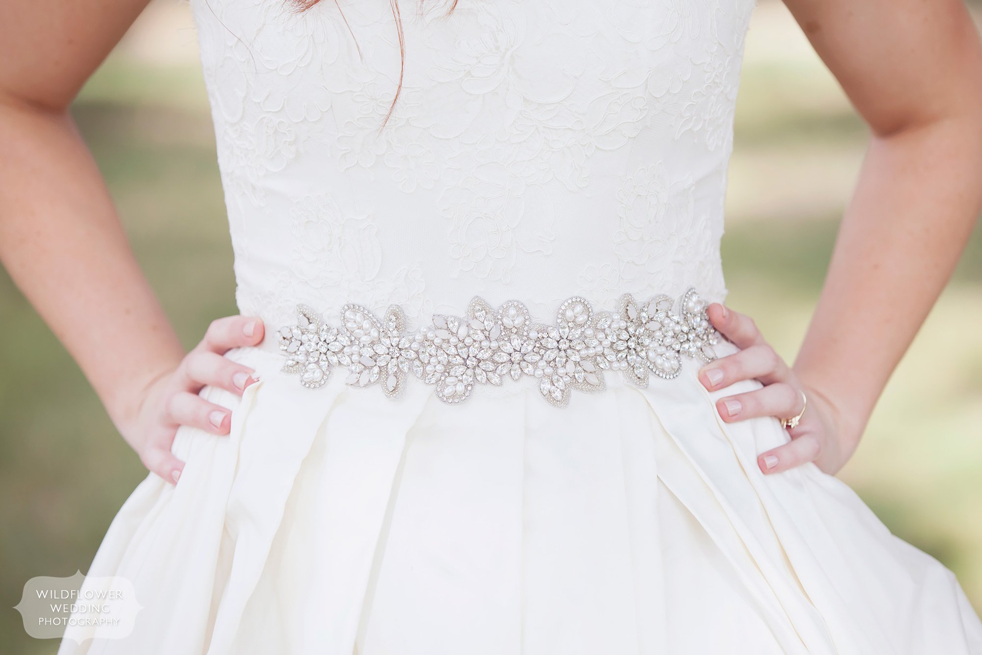 Love this alternative wedding photography image of the bride's sparkle belt with her dress in MO.