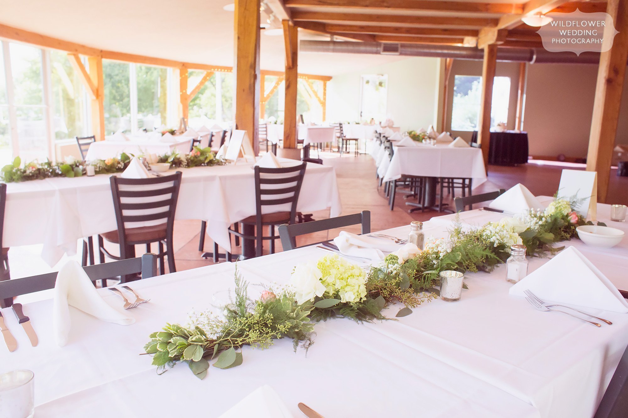 Great idea for simple table runners of greenery garlands at Les Bourgeois in Rocheport, MO.