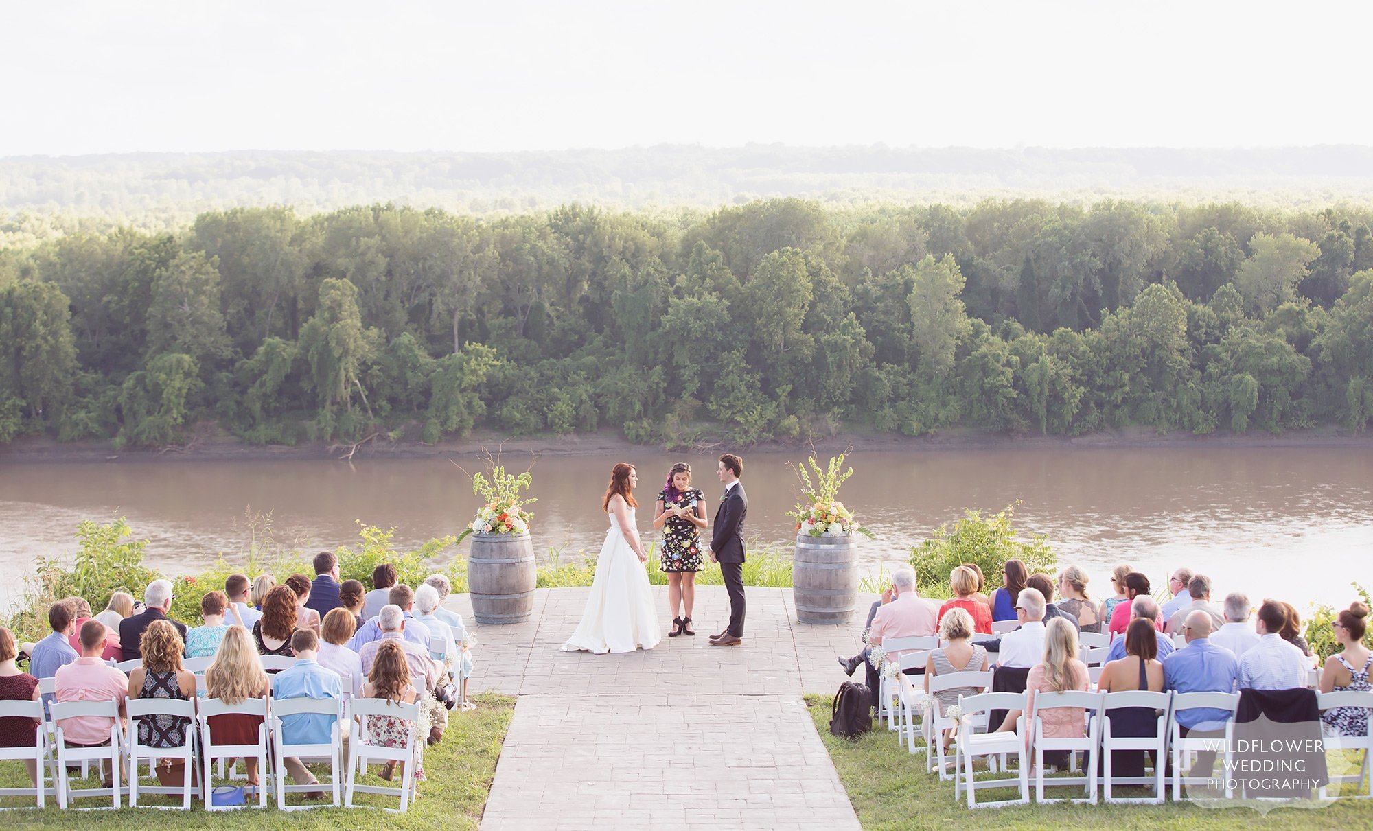 Outdoor summer wedding ceremony on the blufftop at Les Bourgeois Winery in Rocheport, MO.