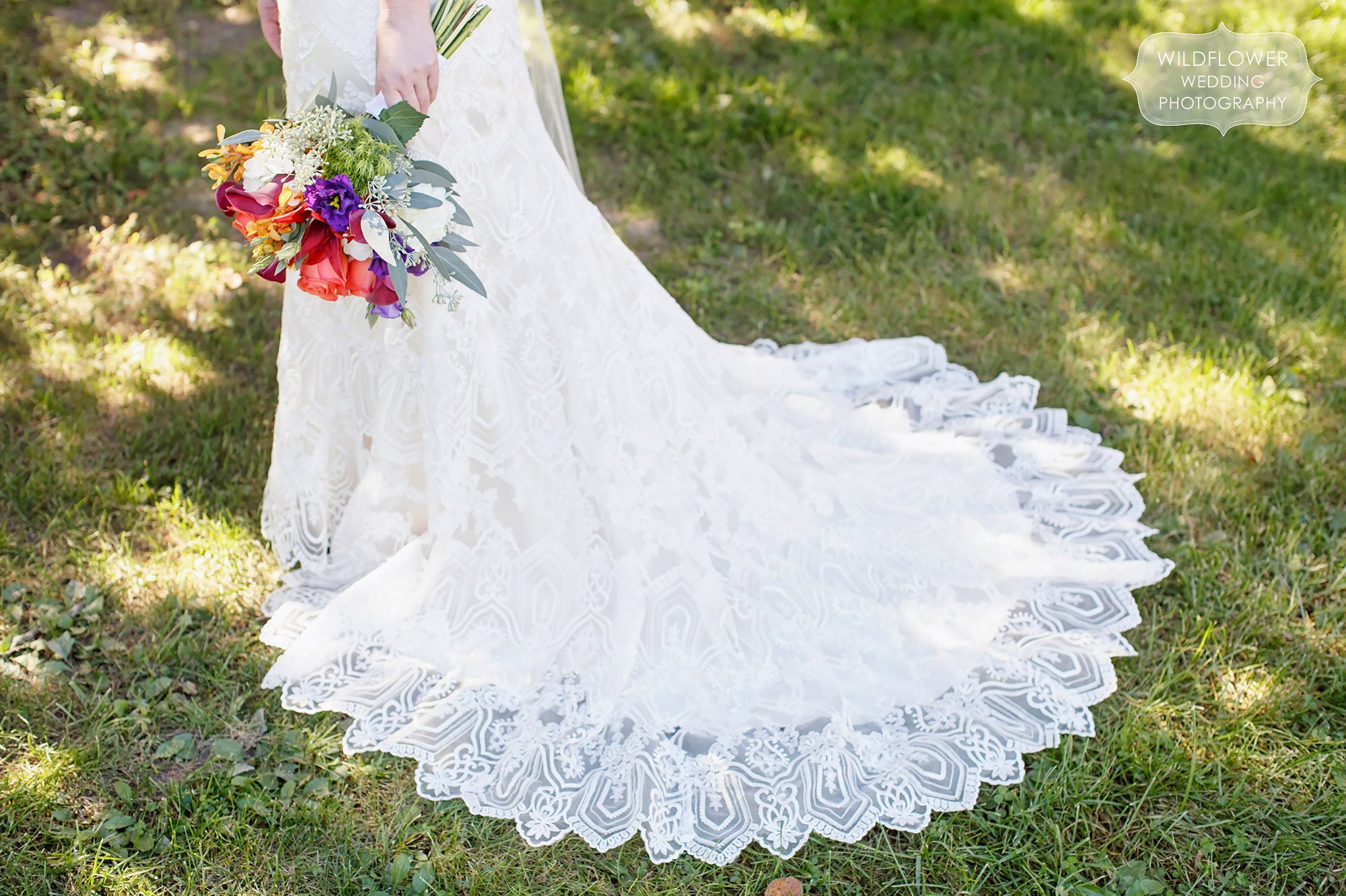 Stunning lace wedding dress with train by Maggie Sottero.