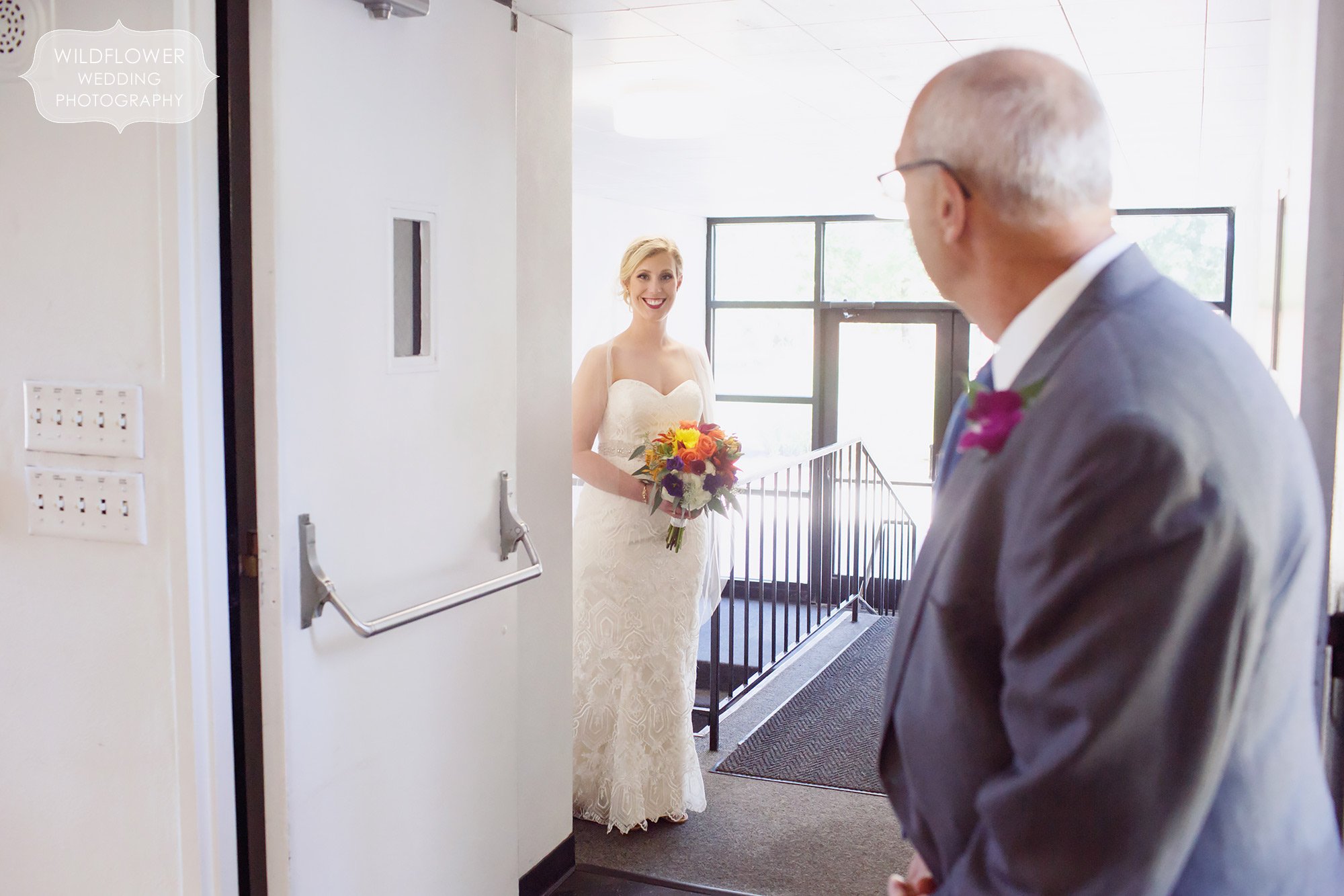 Documentary photo of the bride getting ready to walk down the aisle with her dad at St. Anselm church in St. Louis.