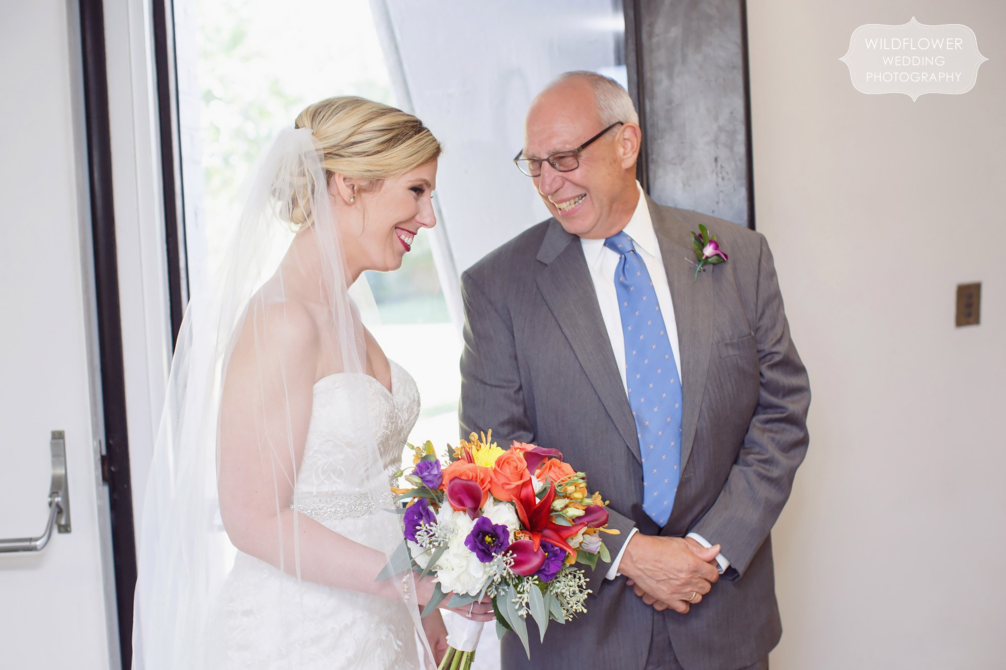 The bride laughs with her dad before her St. Anselm parish wedding in St. Louis.