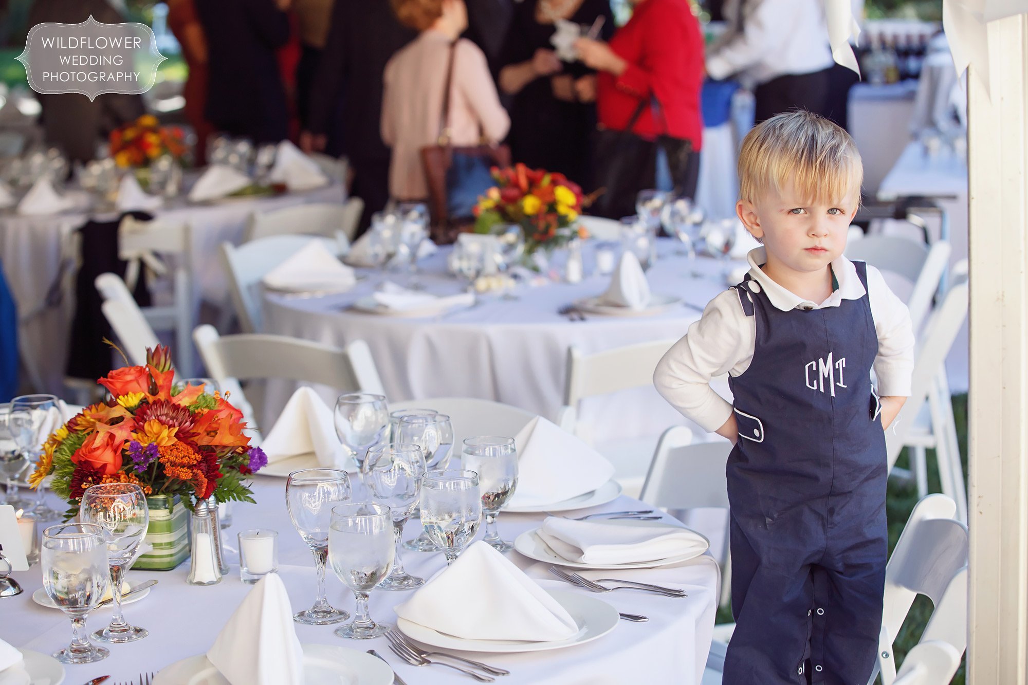 Funny photo of a toddler at this backyard wedding in St. Louis, MO.