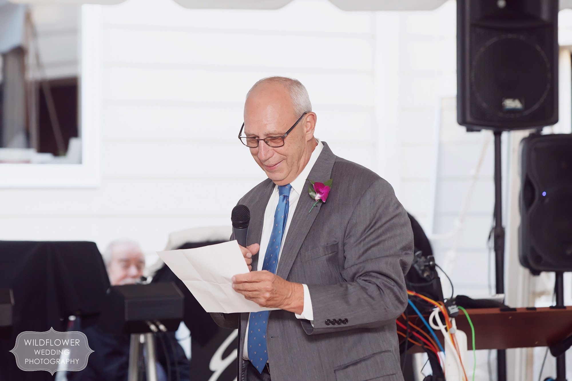 The father of the bride, Dr. Joseph Hurley, gives a speech to his daughter at this backyard wedding in St. Louis.
