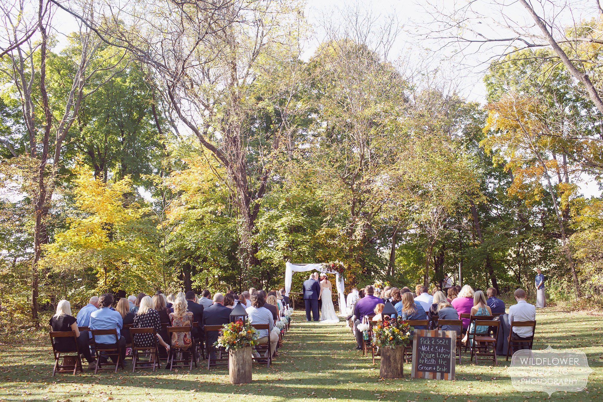 Overview image of the outdoor ceremony space at the Schwinn Produce Farm venue for an autumn October wedding.