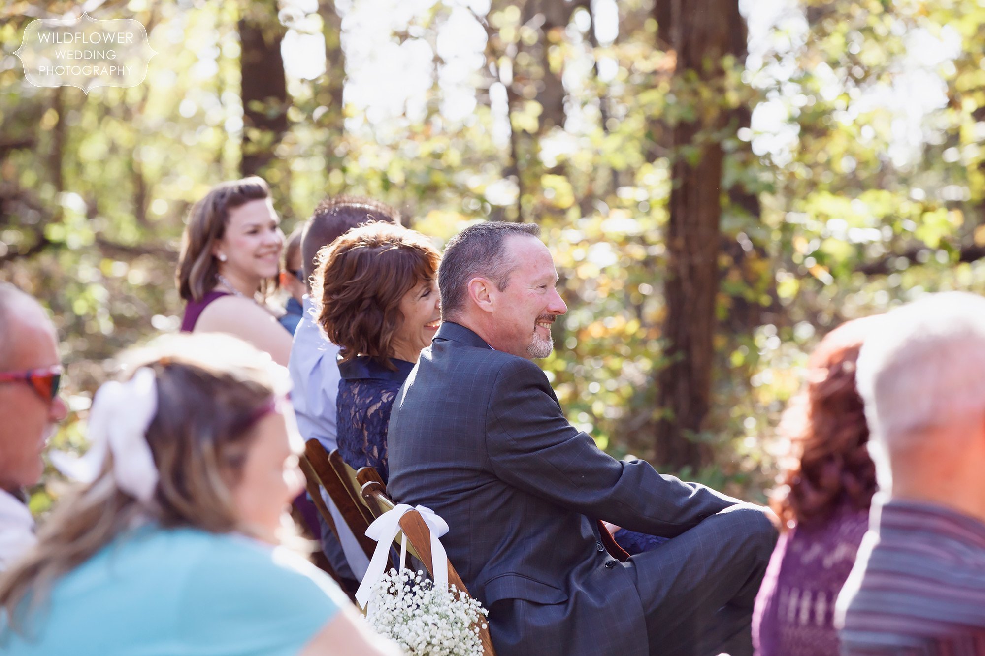 Wedding guests watch the rustic ceremony at the Schwinn Produce Farm.