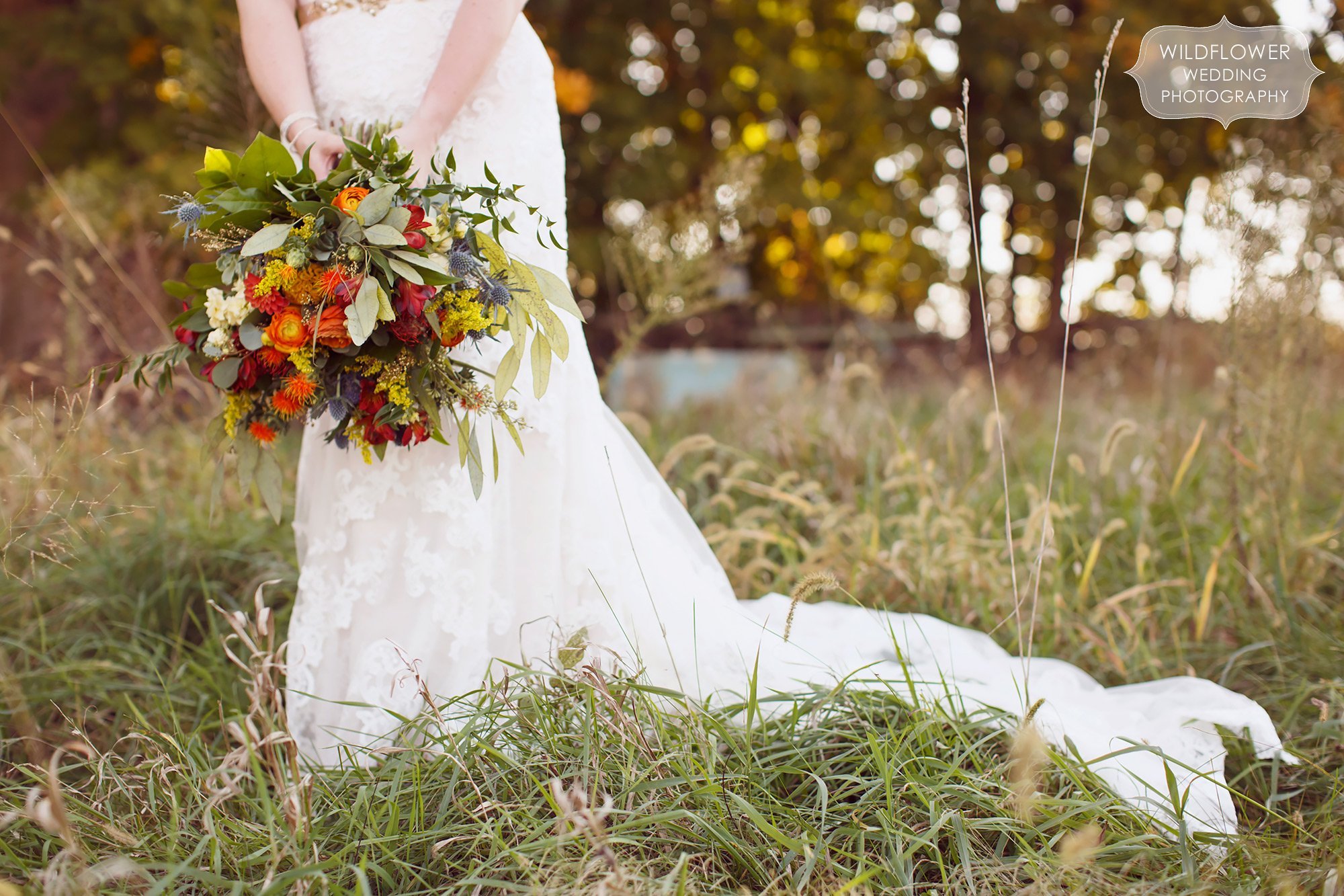 Large cascading flower bouquet with succulents at the Schwinn Produce Farm wedding in Kansas.