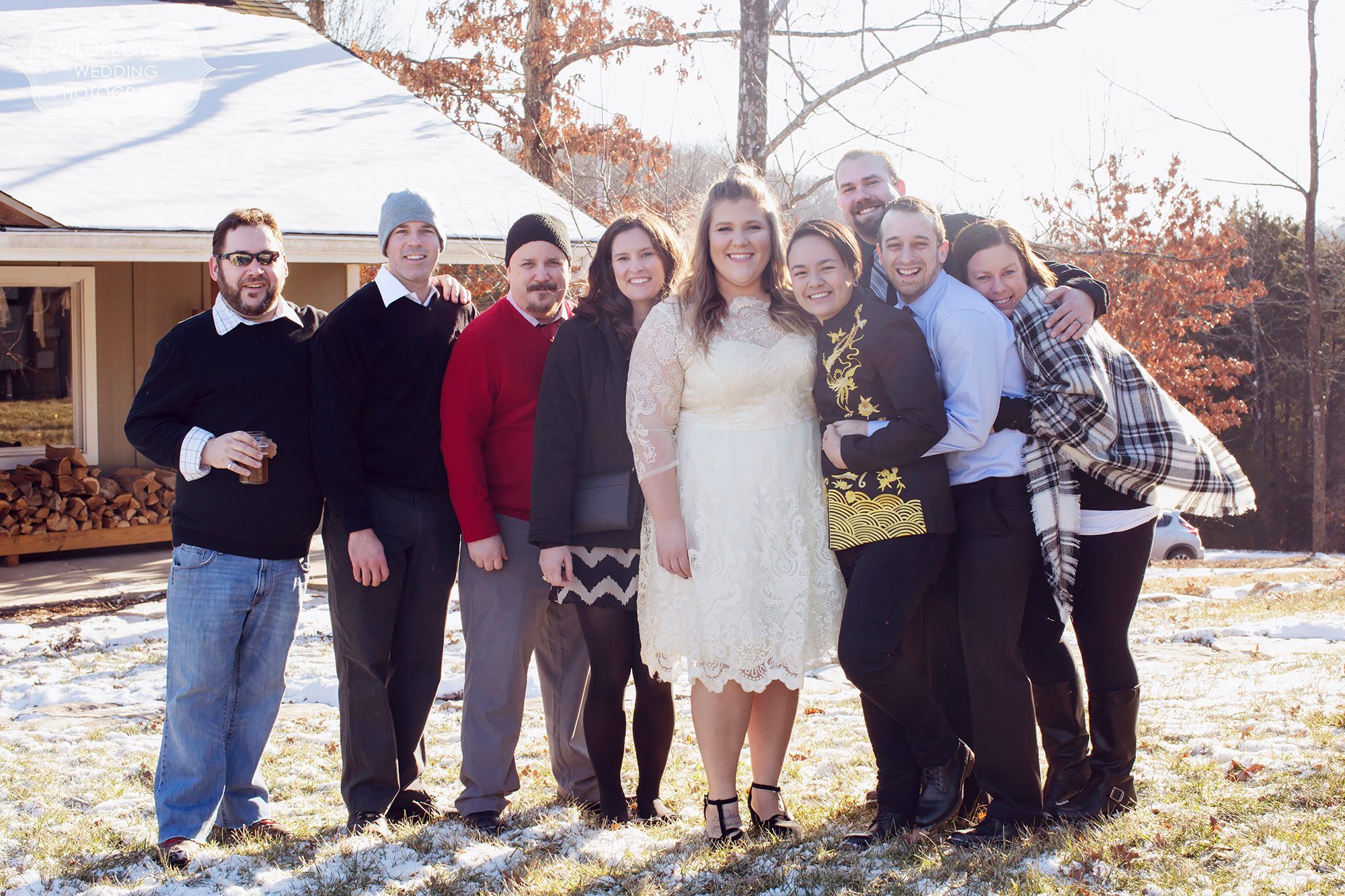 Group photo of friends after this winter wedding in Columbia, MO.