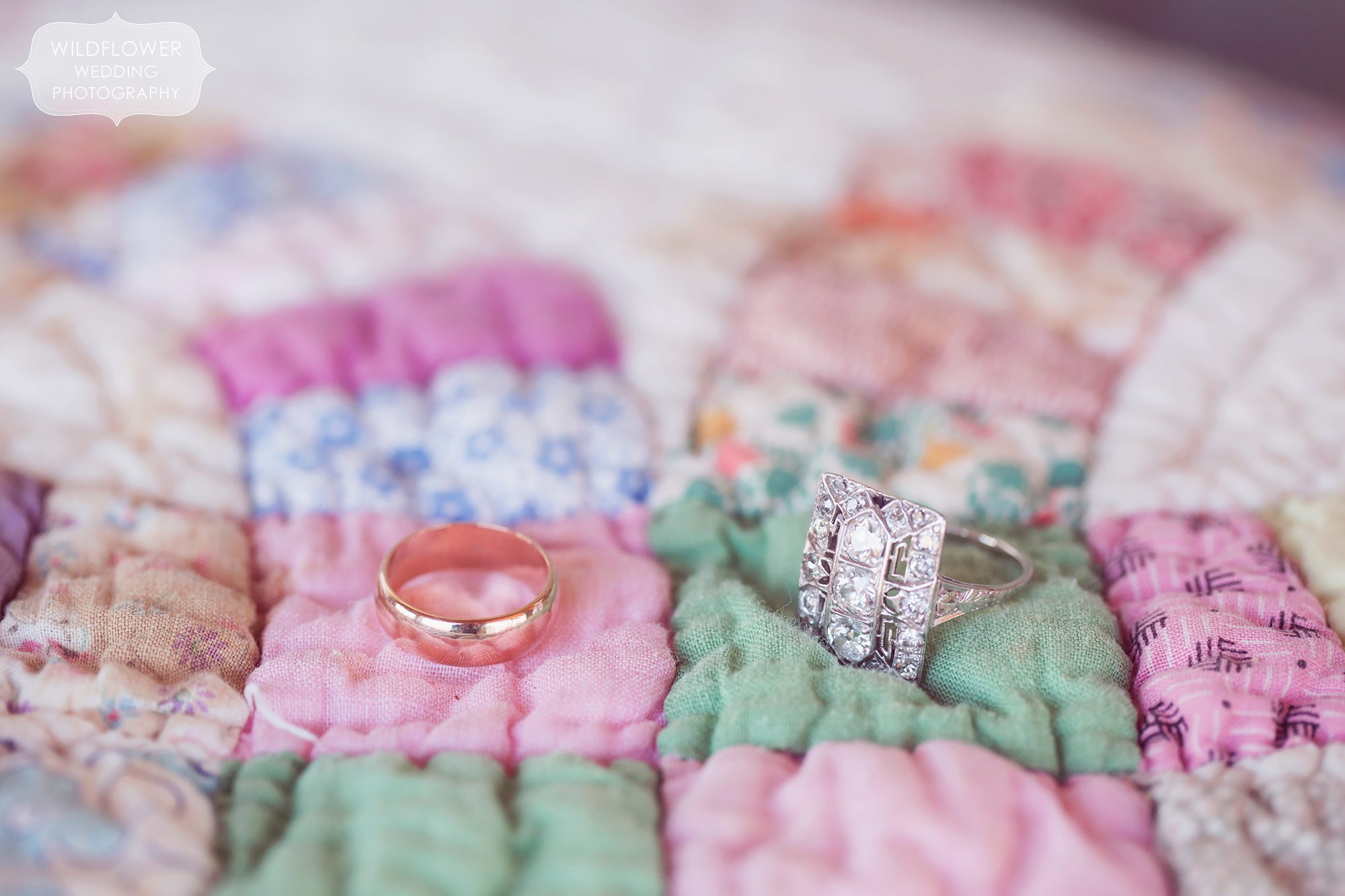 Wedding rings on a handmade colorful quilt for this winter wedding.
