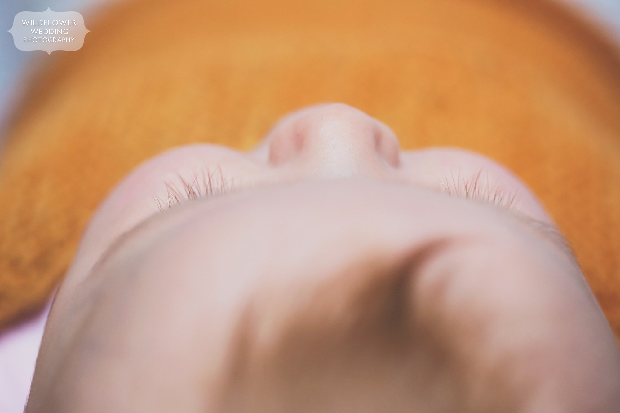 Artsy photo of a redheaded baby eyelashes from above in Columbia, MO.
