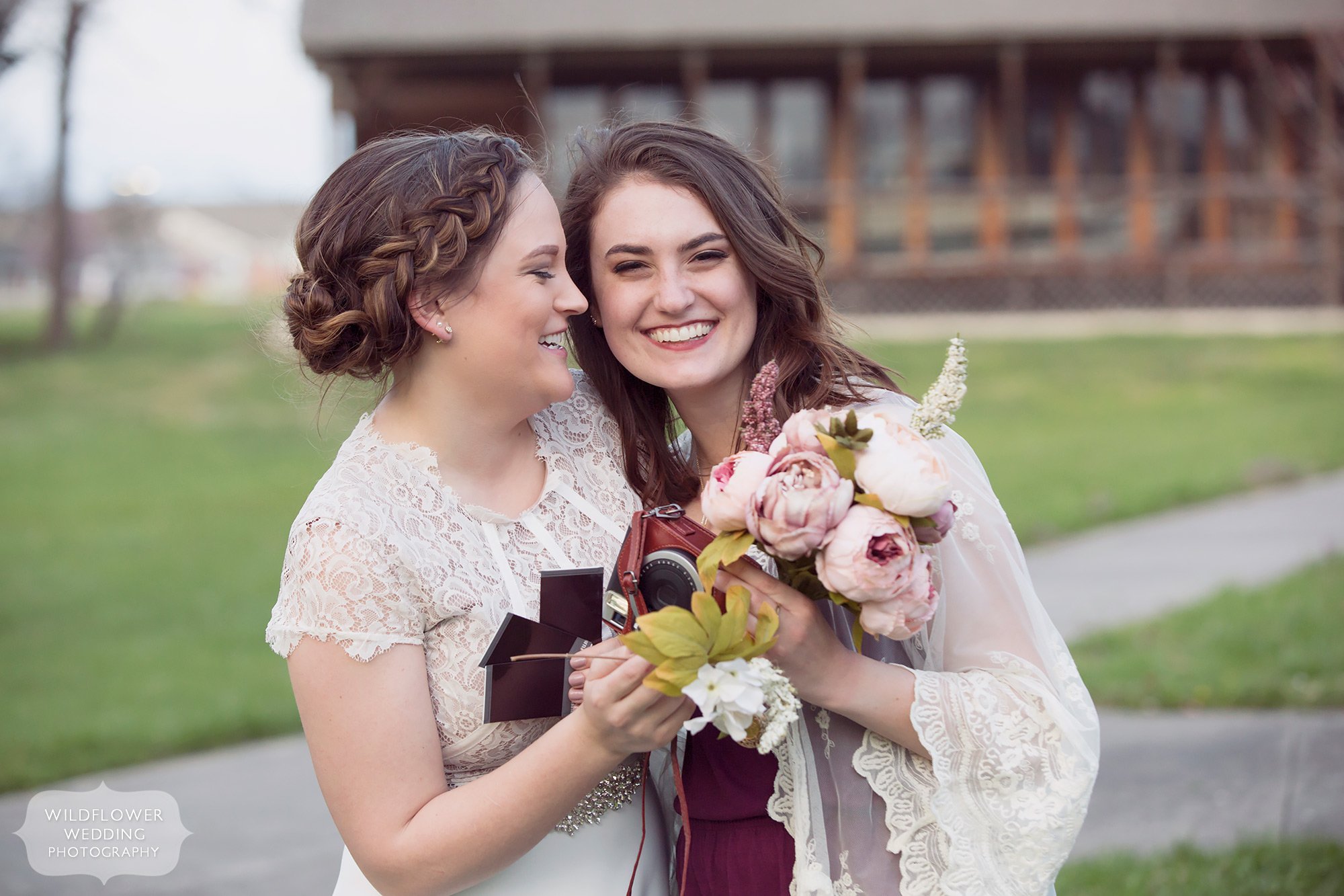 Bride laughing with her best friend and maid of honor at Nifong Park elopement.