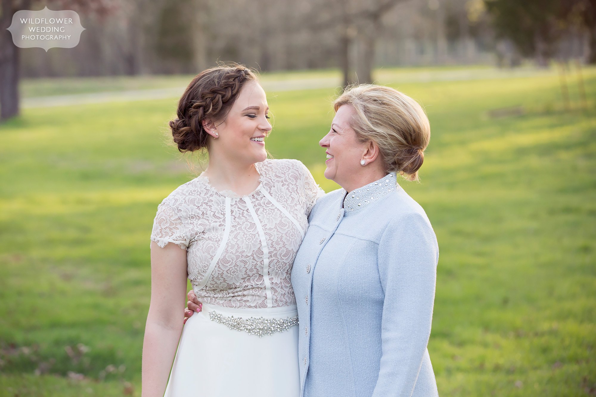 Sweet photo of the bride and her mother after a springtime elopement ceremony.