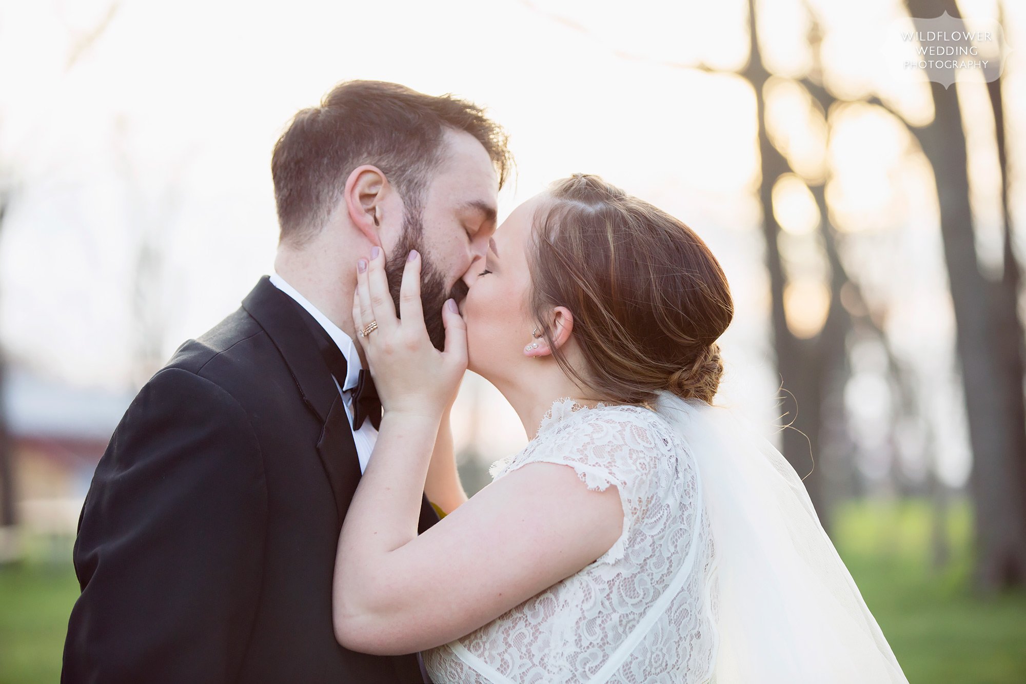Sexy photo of the bride and groom kissing after their rustic elopement wedding in Columbia, MO.