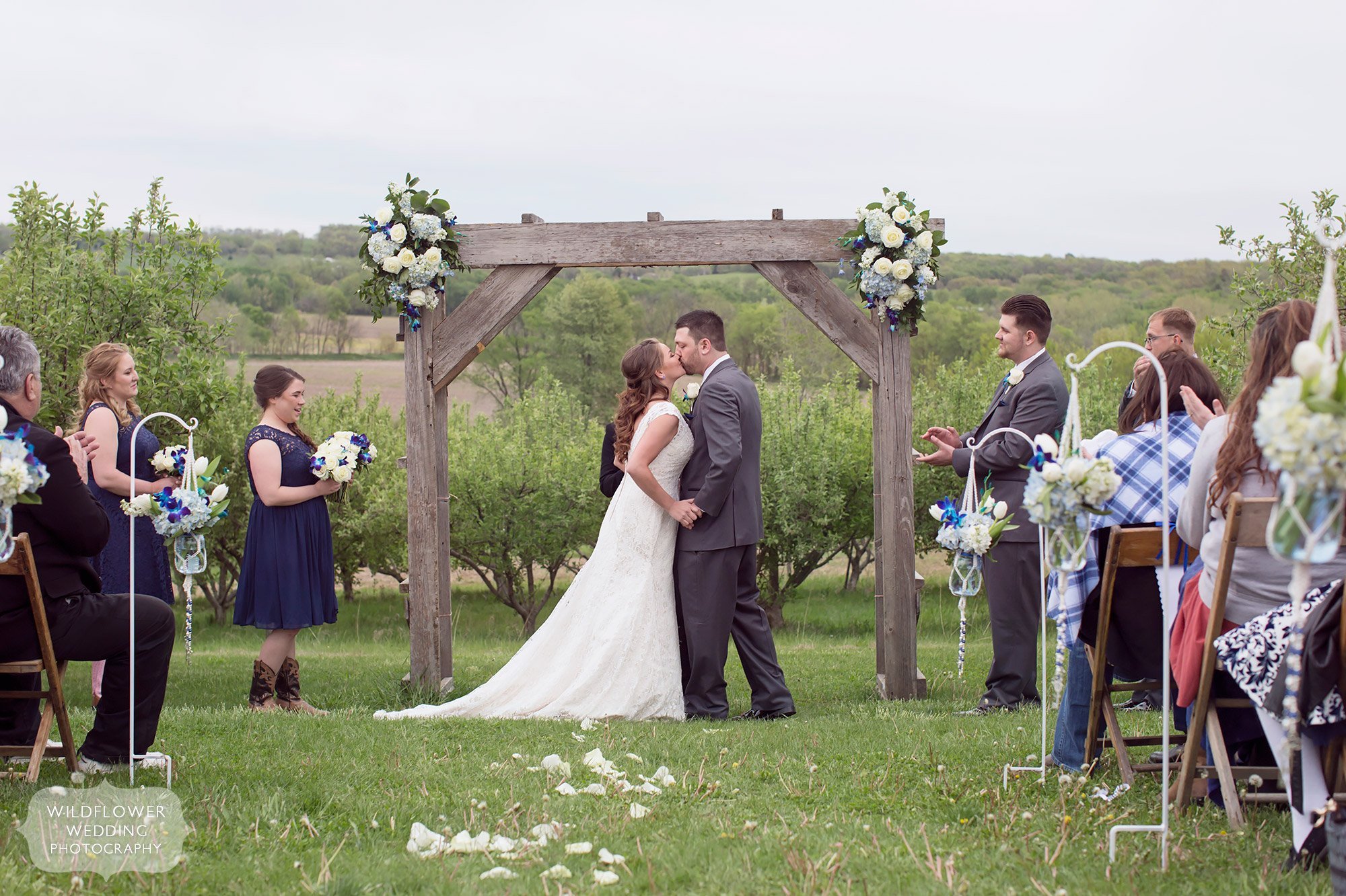 Ceremony kiss at the Weston Red Barn Farm in MO.