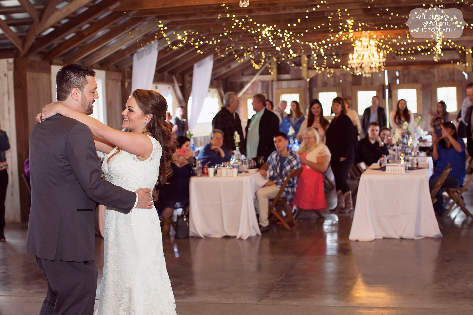 First dance under twinkle lights in the red barn in Weston, MO.