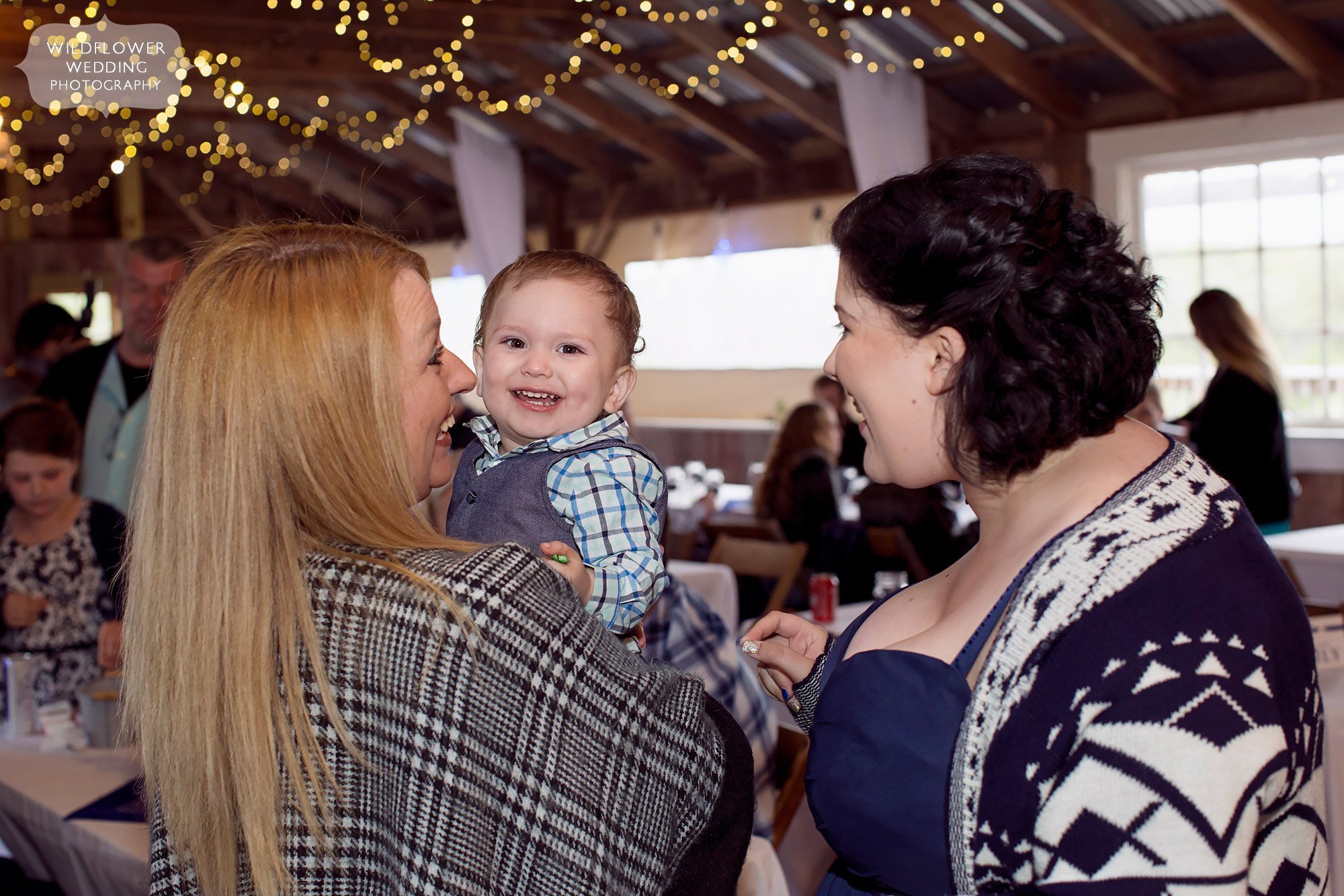 Sweet photo of a baby at this rustic wedding in Weston, MO.