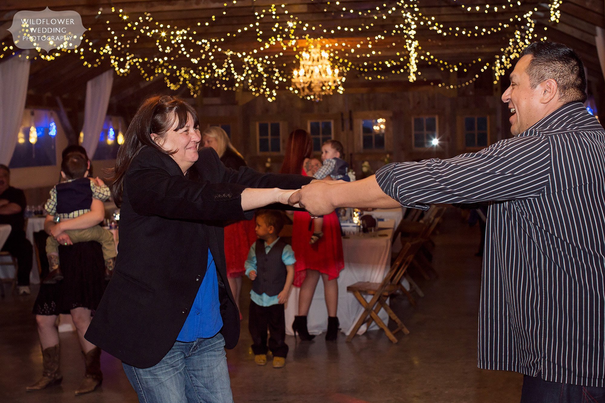 Mother of the bride dances at the Weston Red Barn Farm.