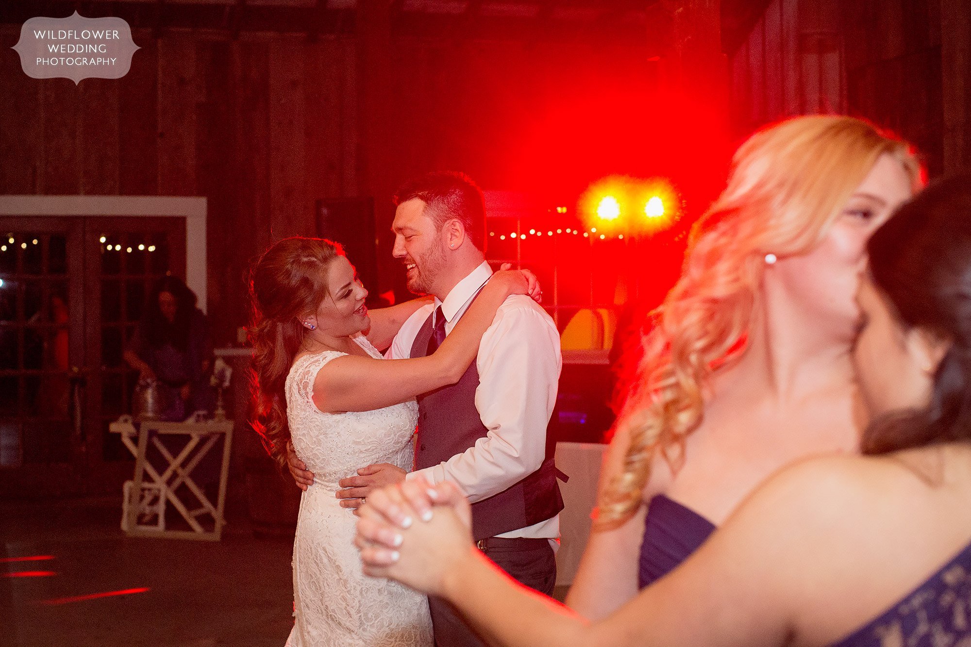 Artistic photo of the bride and groom on the dance floor at this rustic barn wedding north of KC.