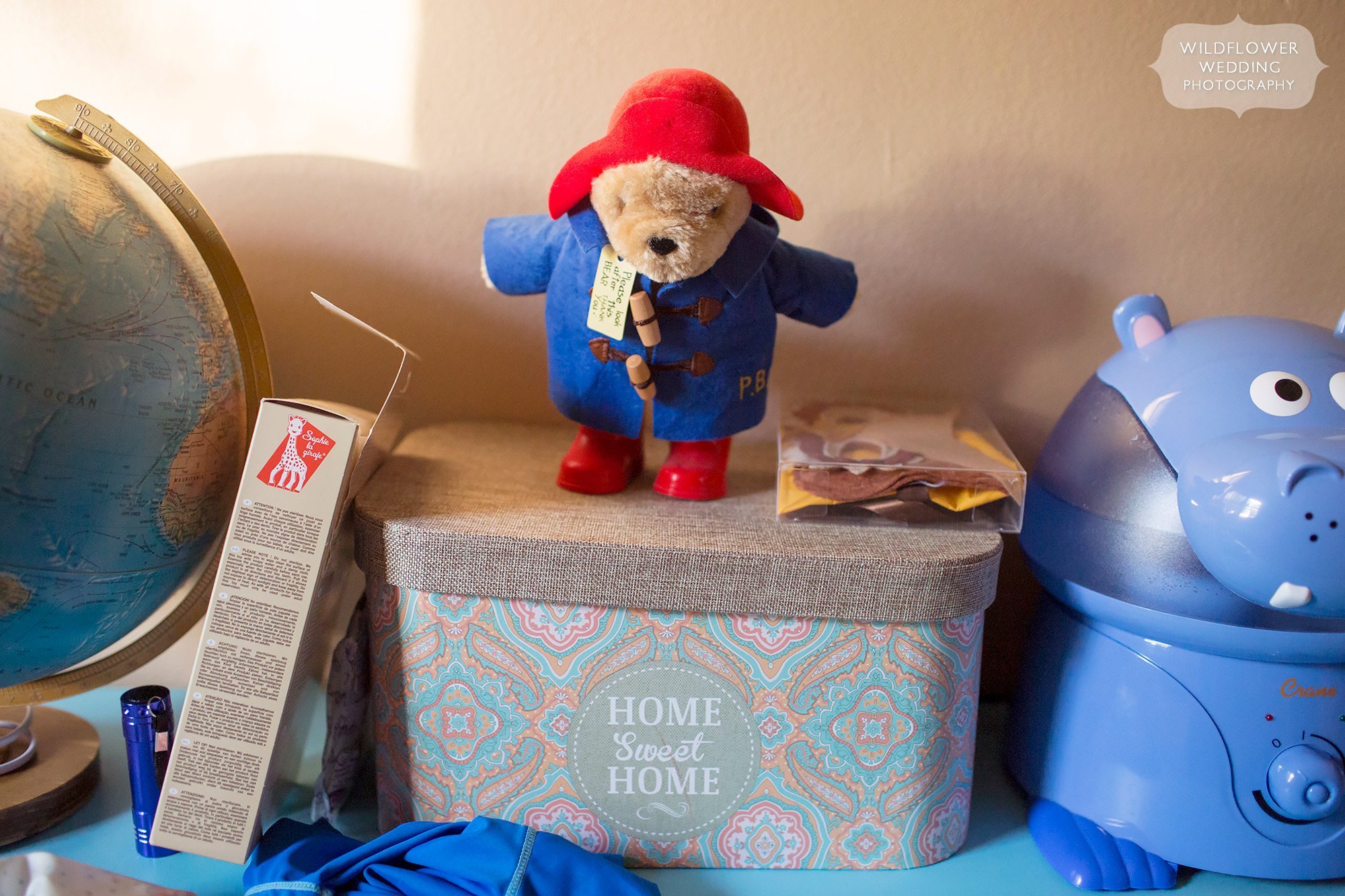Detail photo of Paddington bear in the baby's room during this at home photo session.