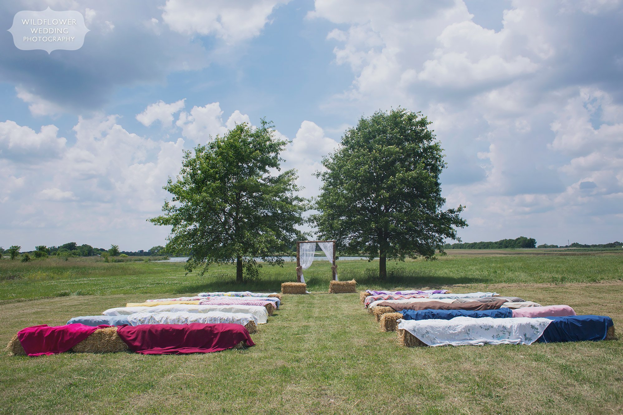Great idea for a country wedding outdoor ceremony with quilts over hay bales at the MU Bradford Farm in Columbia.