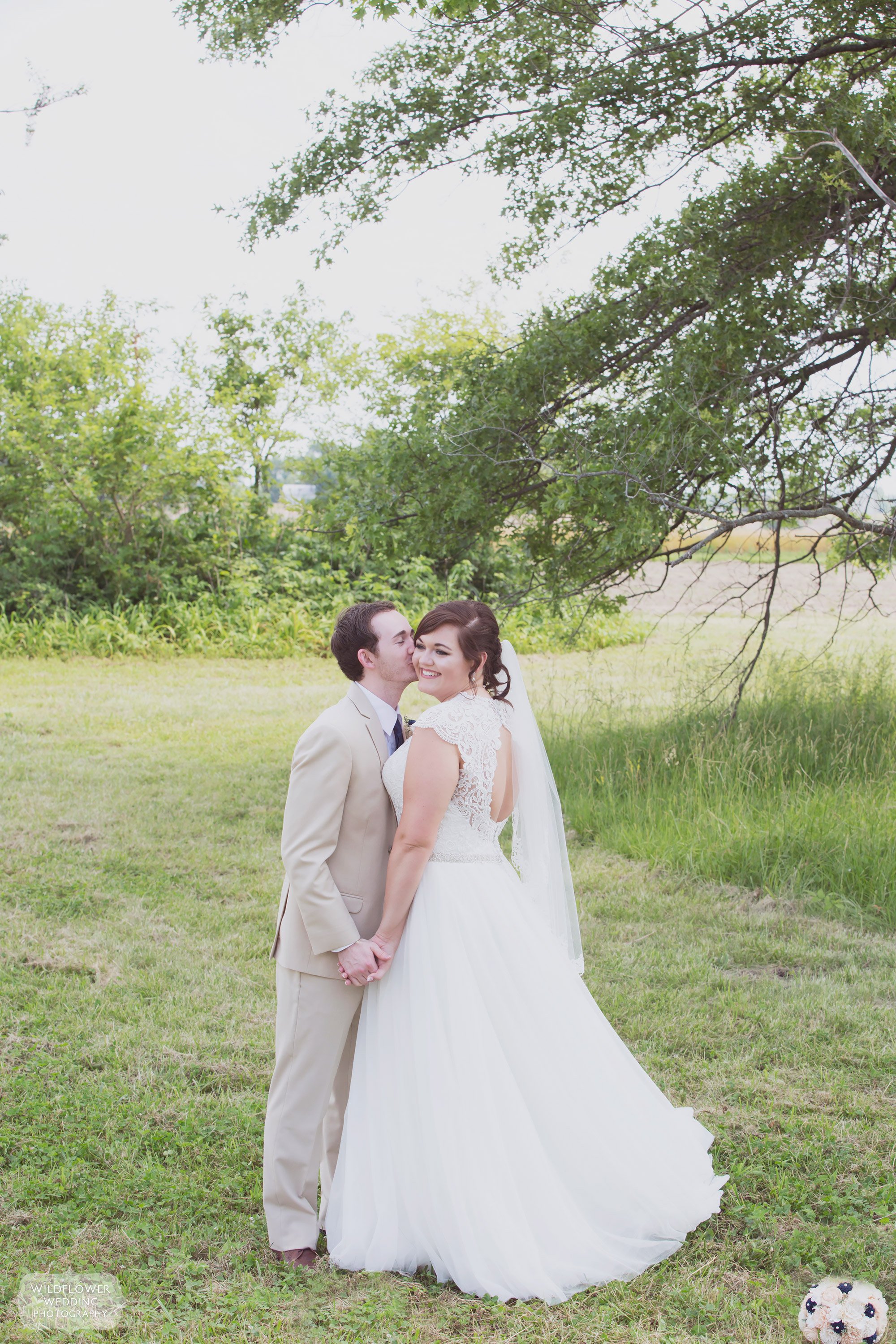 Portrait of the bride and groom with hanging trees at this country wedding at Bradford Farm.