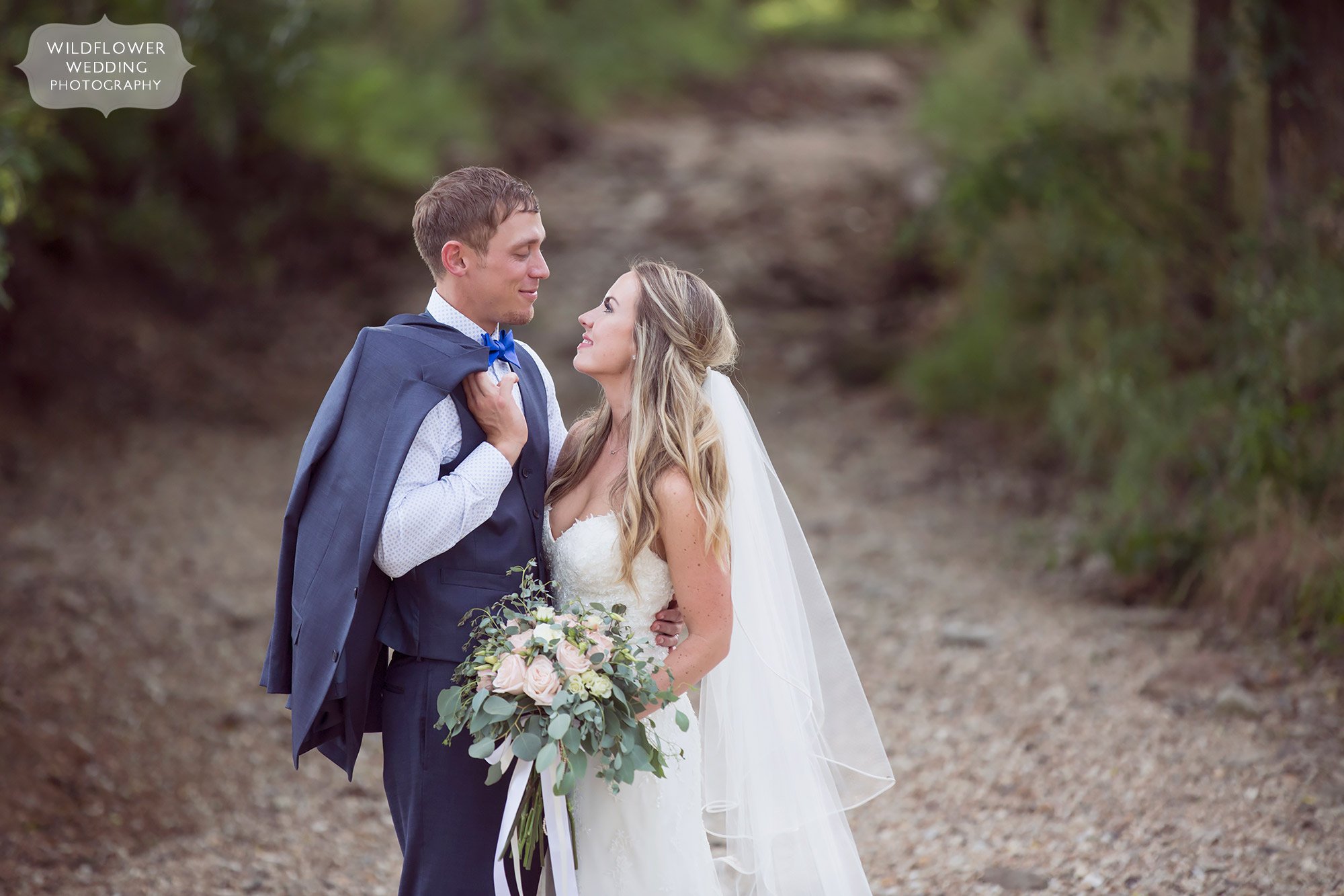 Ethereal photo of the bride and groom in a natural creek bed at Kempker's Back 40.