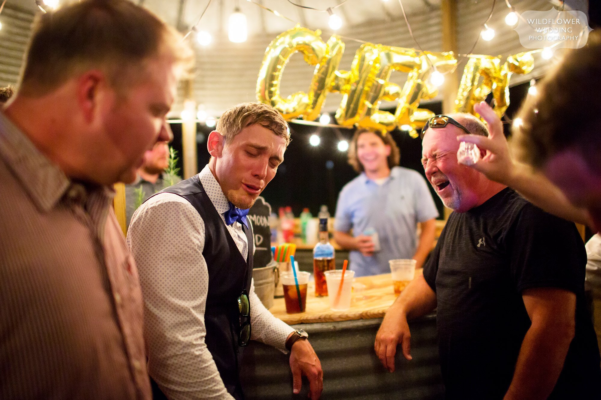 Hilarious photos of faces after doing alcohol shots at the silo bar at this country wedding in MO.