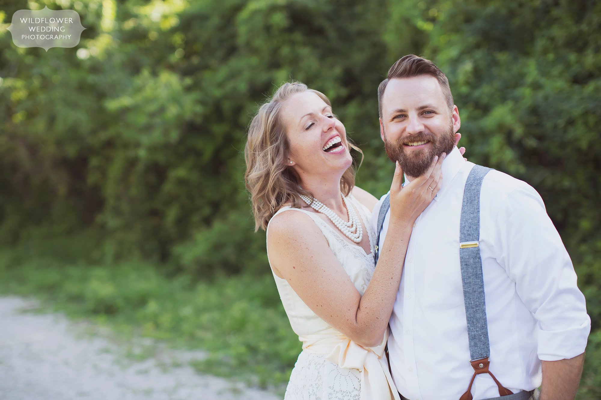 Happy photo of the bride and groom along the Katy Trail before their Rocheport winery wedding in Mid-MO.
