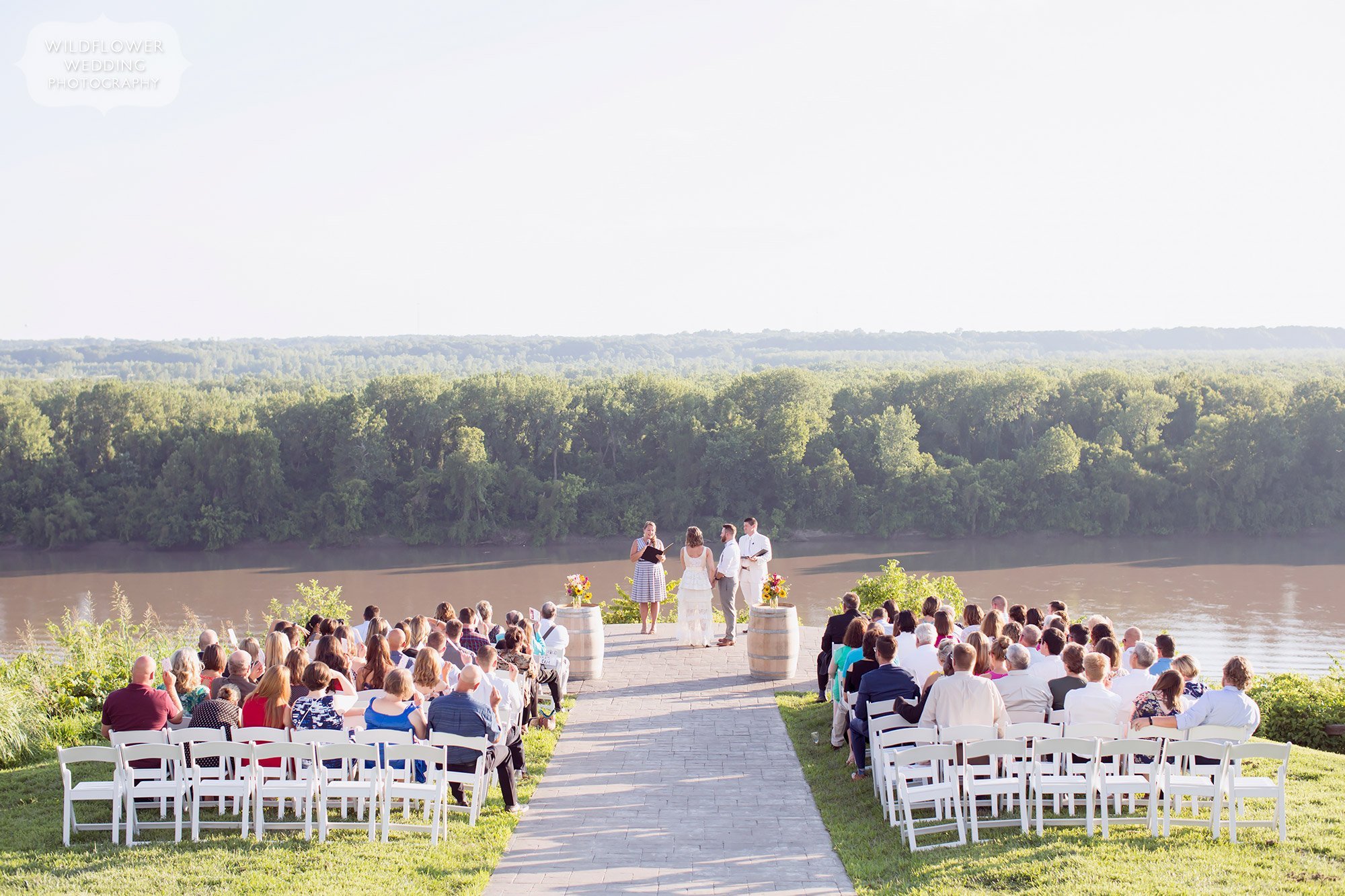 view of blufftop wedding ceremony at les bourgeois with missouri river behind