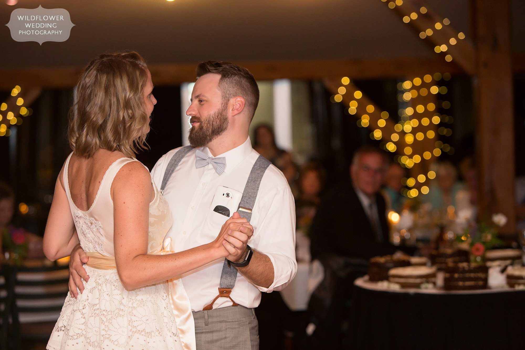 bride and groom have romantic first dance with twinkle lights at les bourgeois