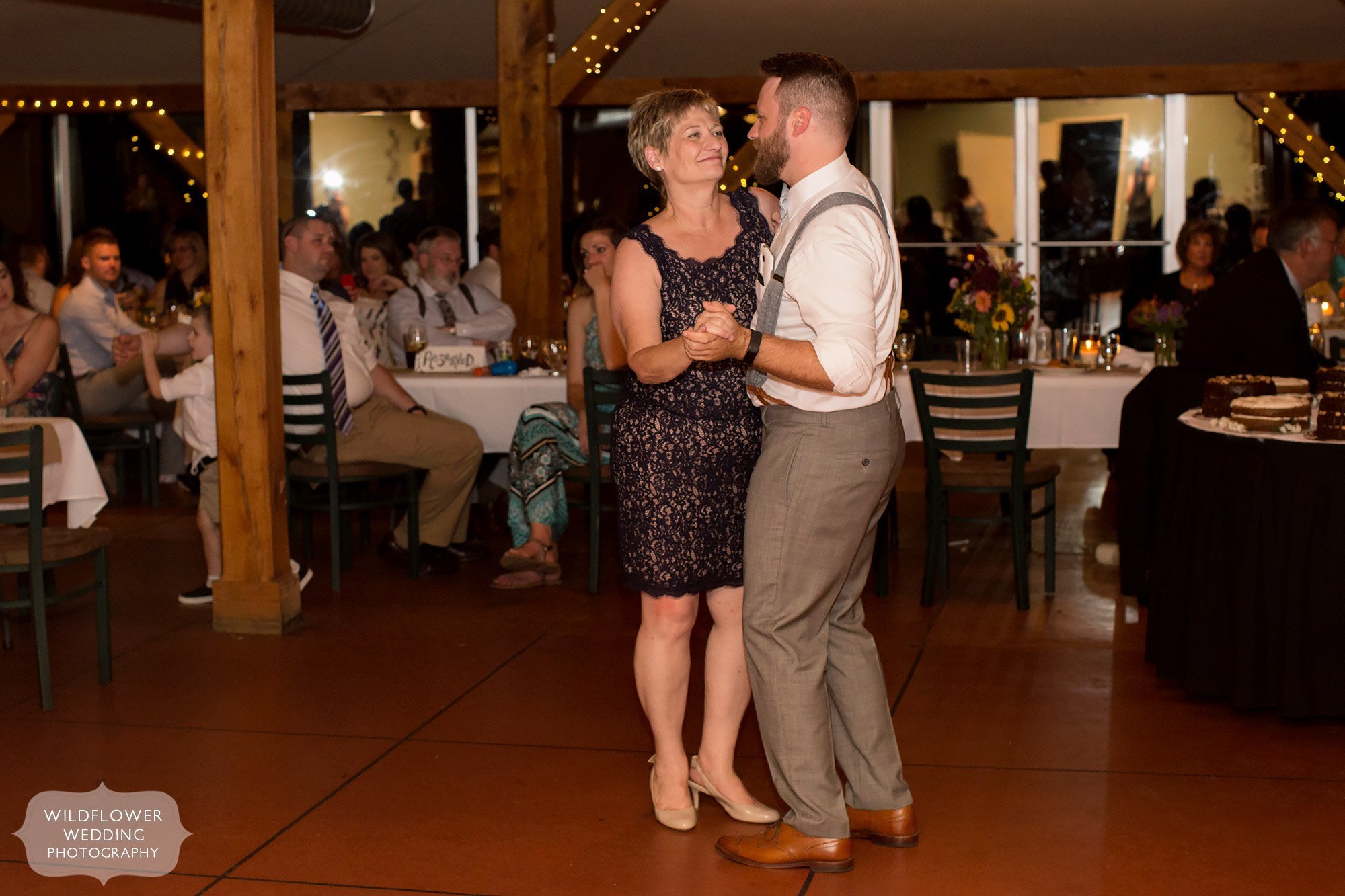 the groom and his mom dance at les bourgeois reception space