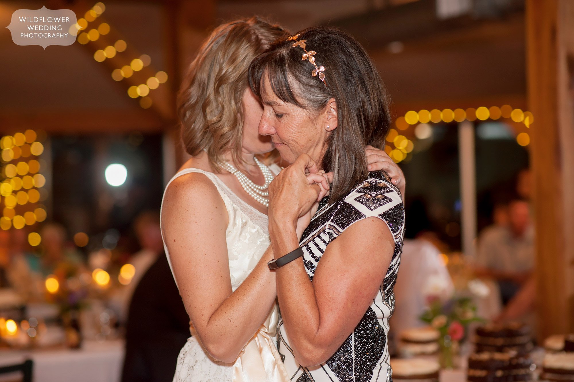 intimate moment of mother and daughter dancing at les bourgeois wedding