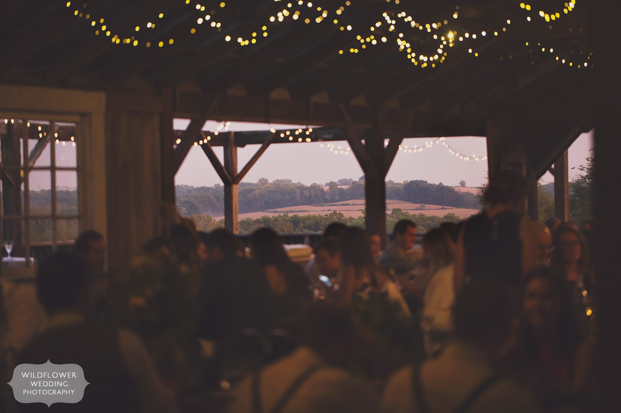 This is the best barn wedding reception spot just north of KC, MO with twinkle lights and scenic rolling hills.