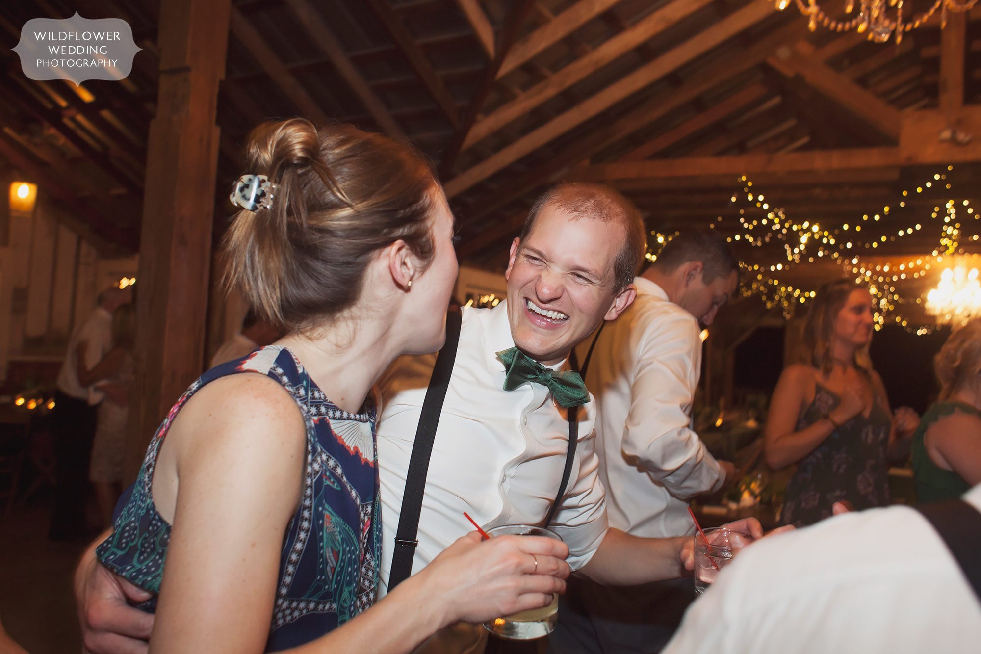 Happy wedding guests on the dance floor at the Weston Red Barn in MO.