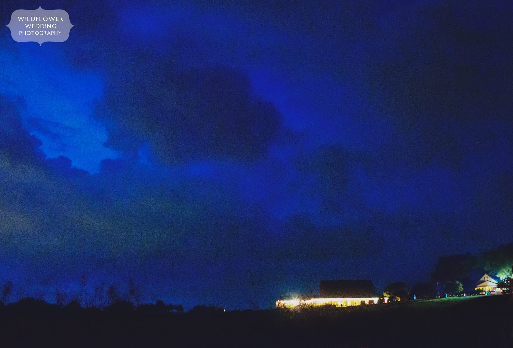 Storm clouds at dusk over the Weston Red Barn Farm wedding venue.