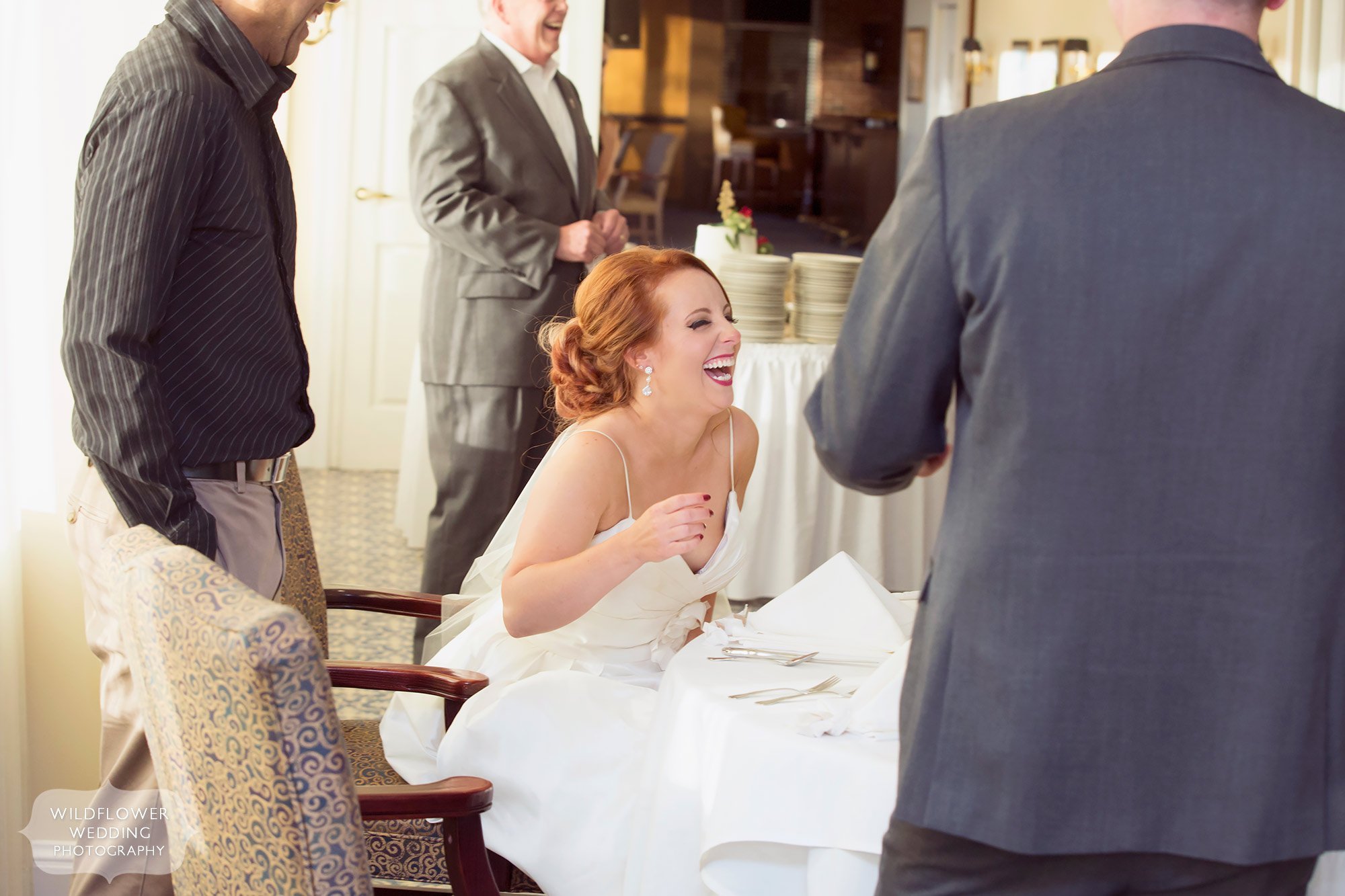 Bride laughing during toasts at the Jefferson City Country Club.