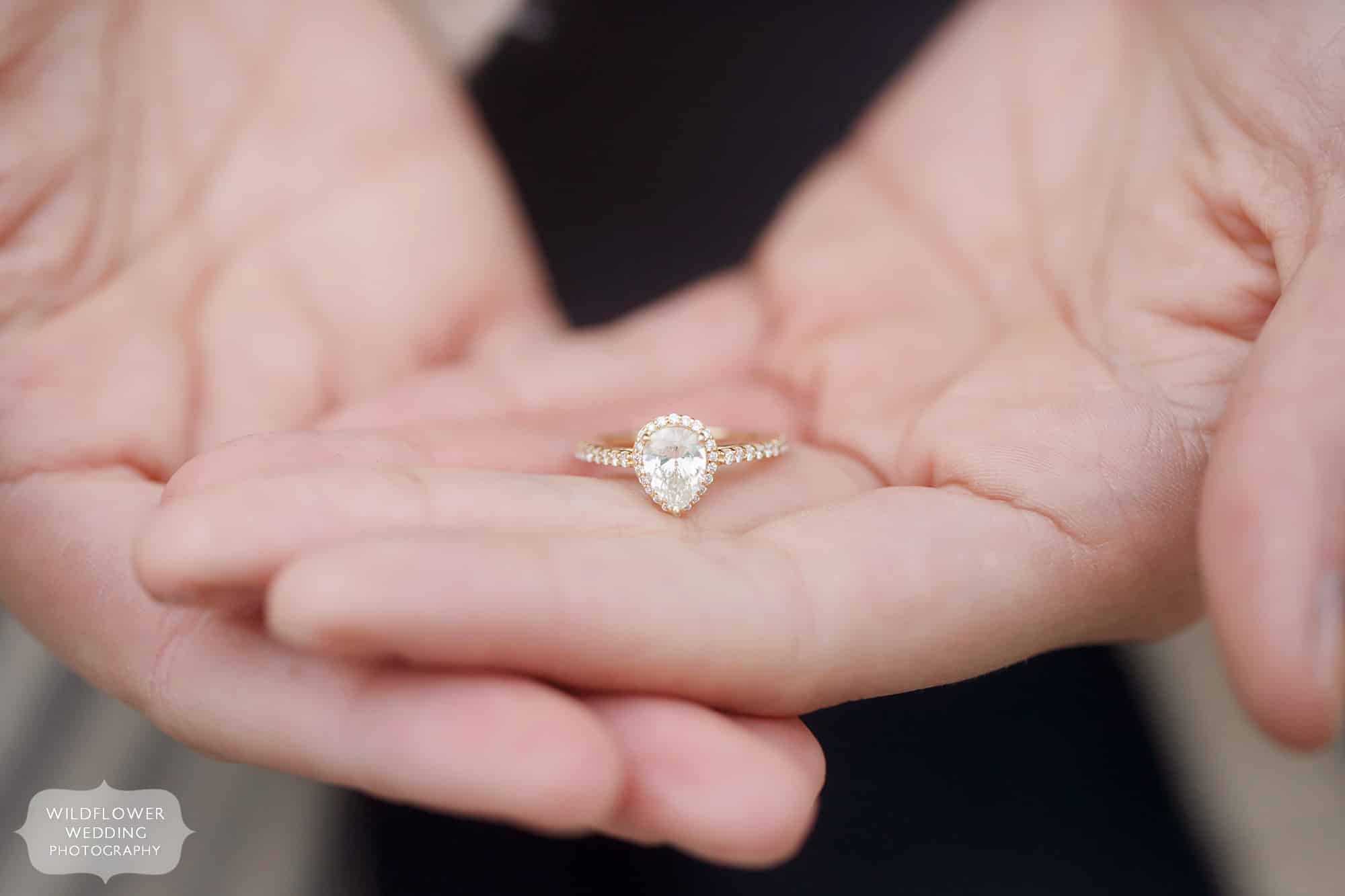 Candid wedding photos of this surprise proposal with a vintage pear shaped diamond engagement ring.
