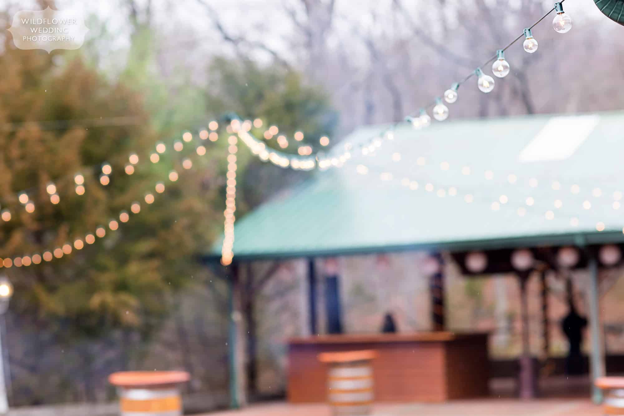 Romantic open pavilion at the Little Piney Lodge wedding venue with string cafe lights canopy in Hermann.