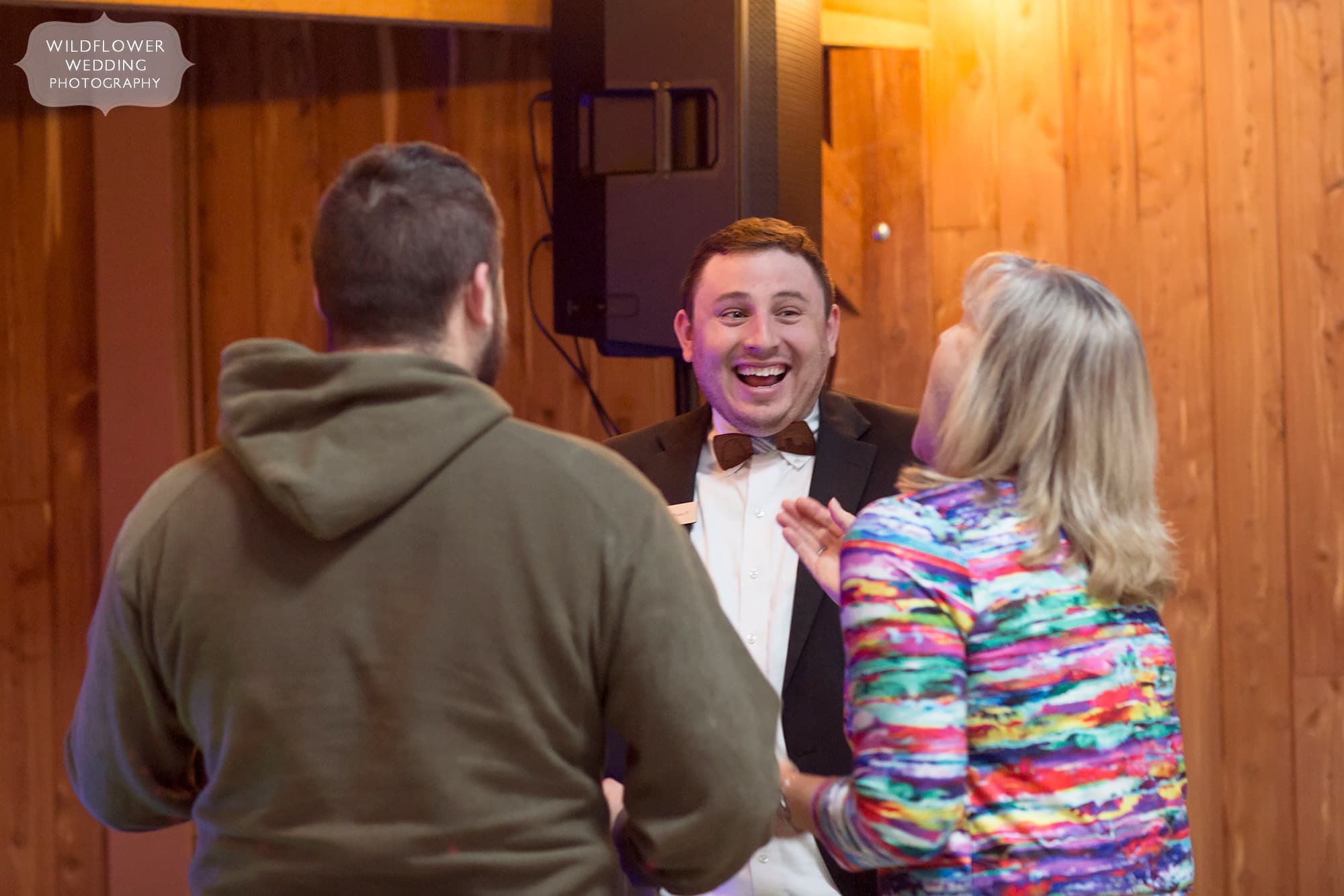 Nathan Pierce of Complete DJ service talks with a couple at the Little Piney Lodge wedding venue.