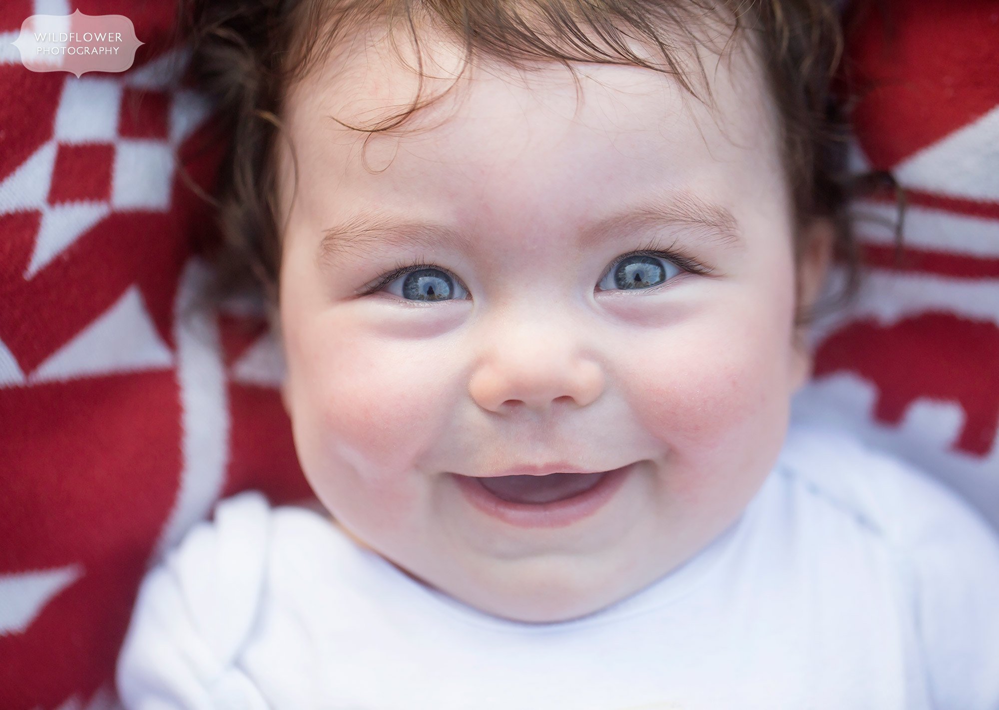 Close up photo of smiling baby in Columbia, MO.