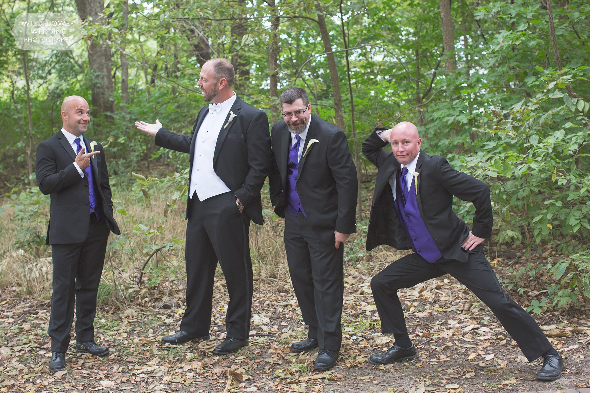 Funny photo of the groomsmen in the woods at Schwinn Barn in KS.