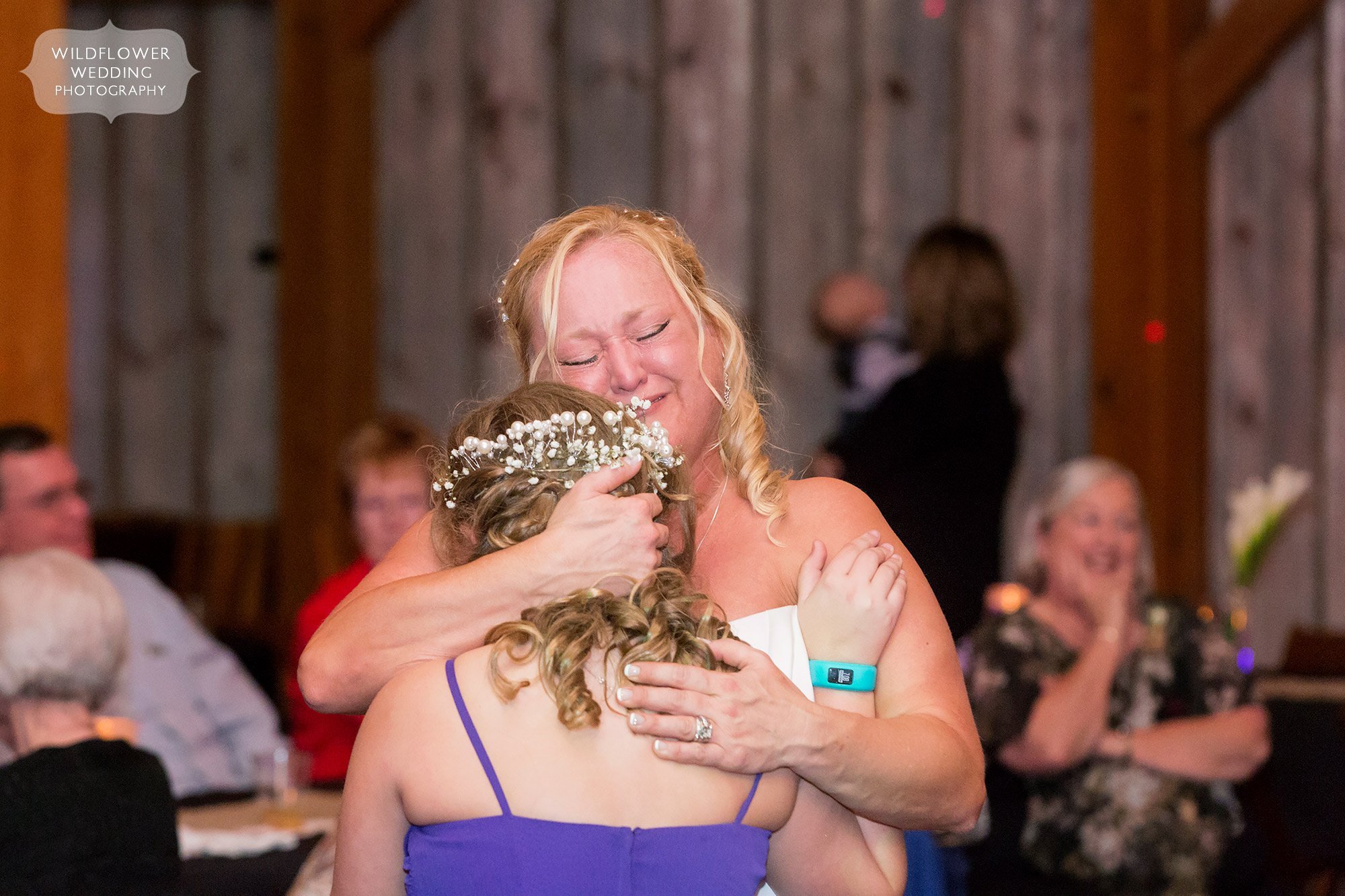 Emotional moment of bride dancing with her daughter for this KS barn wedding.