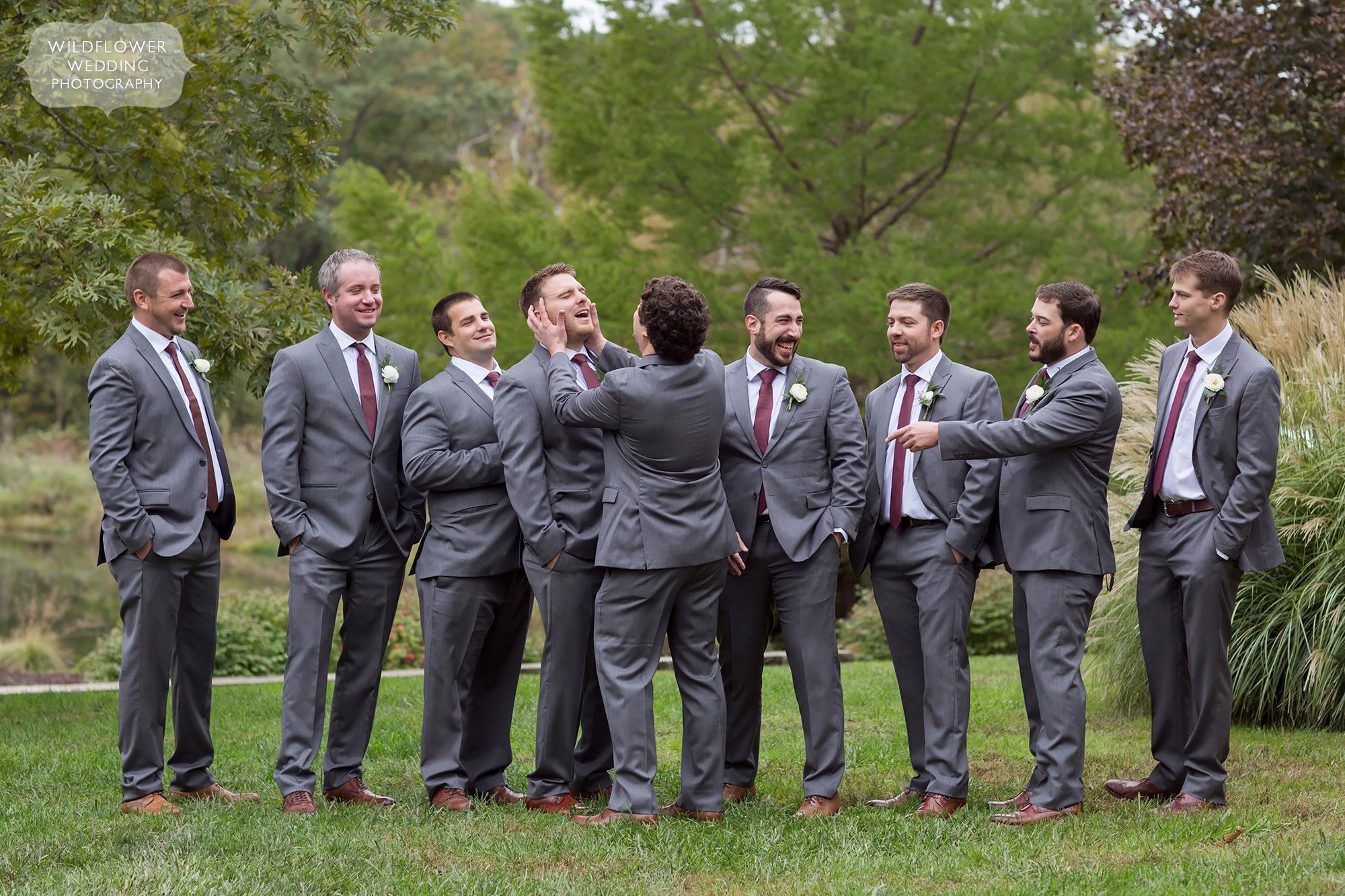Funny groomsmen photos at the Little Piney Lodge woodsy wedding venue.