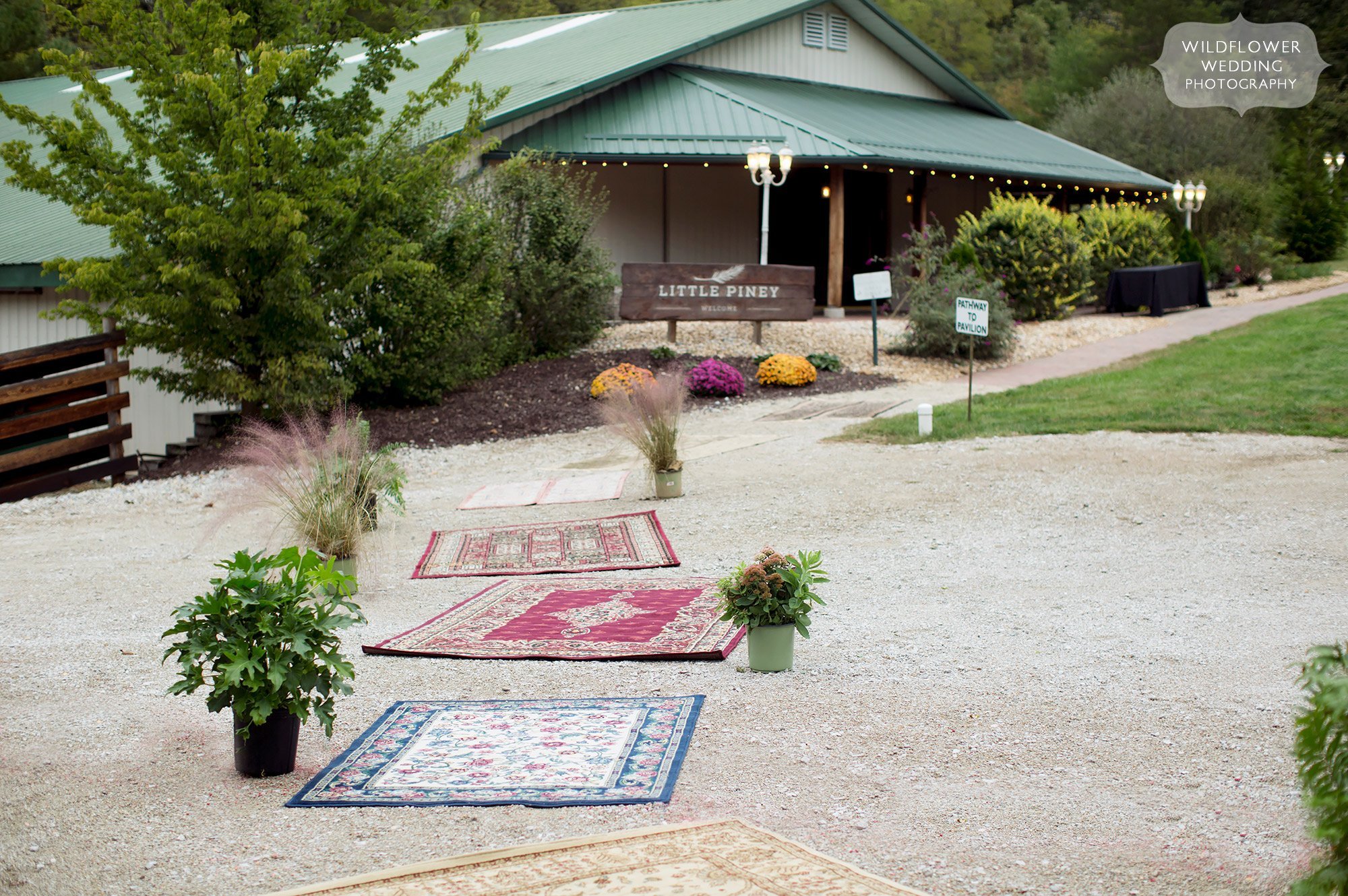 Boho wedding decor with persian rugs at Little Piney Lodge in Hermann, MO.