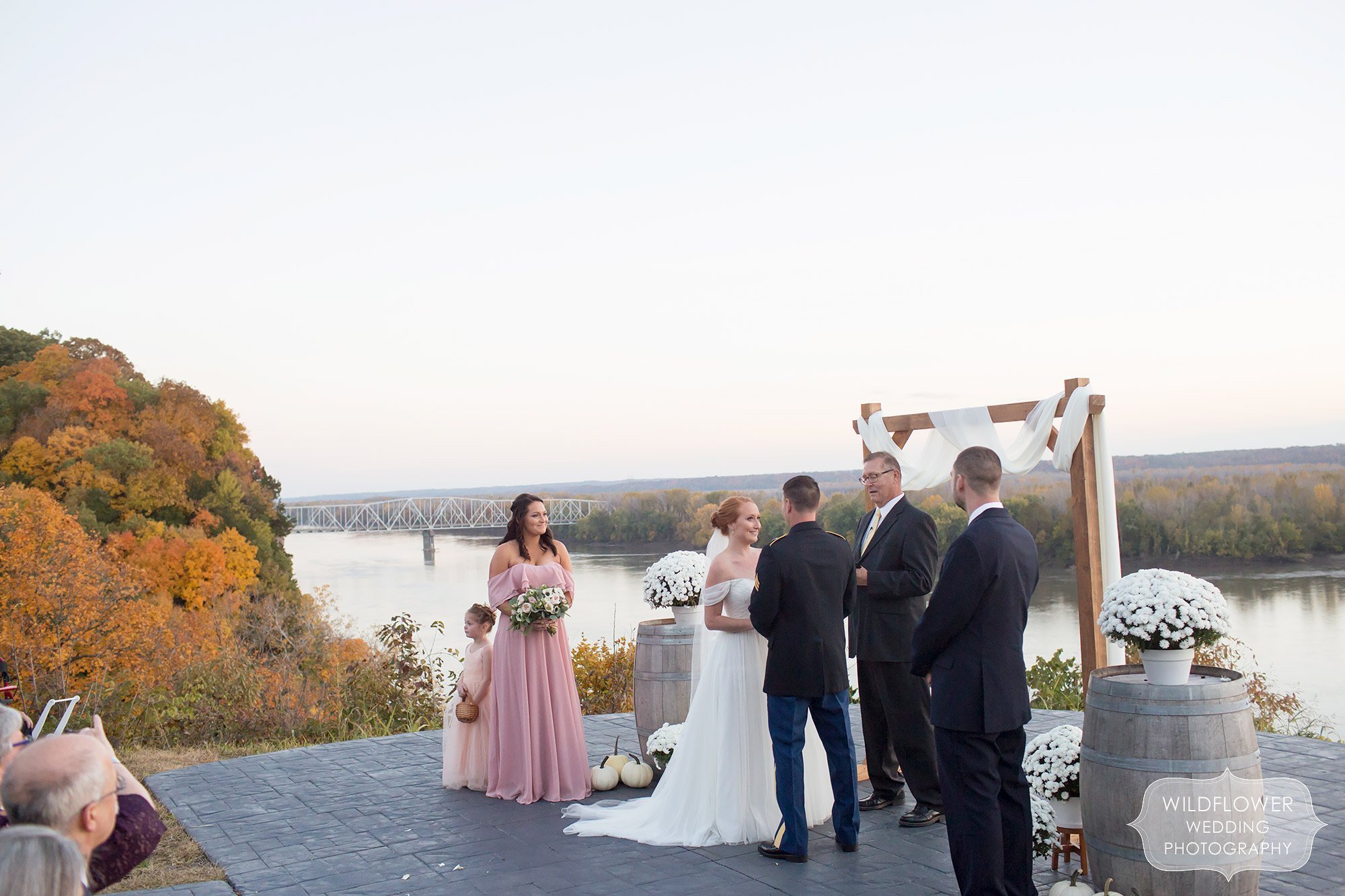 Beautiful outdoor wedding ceremony overlooking river at Les Bourgeois.