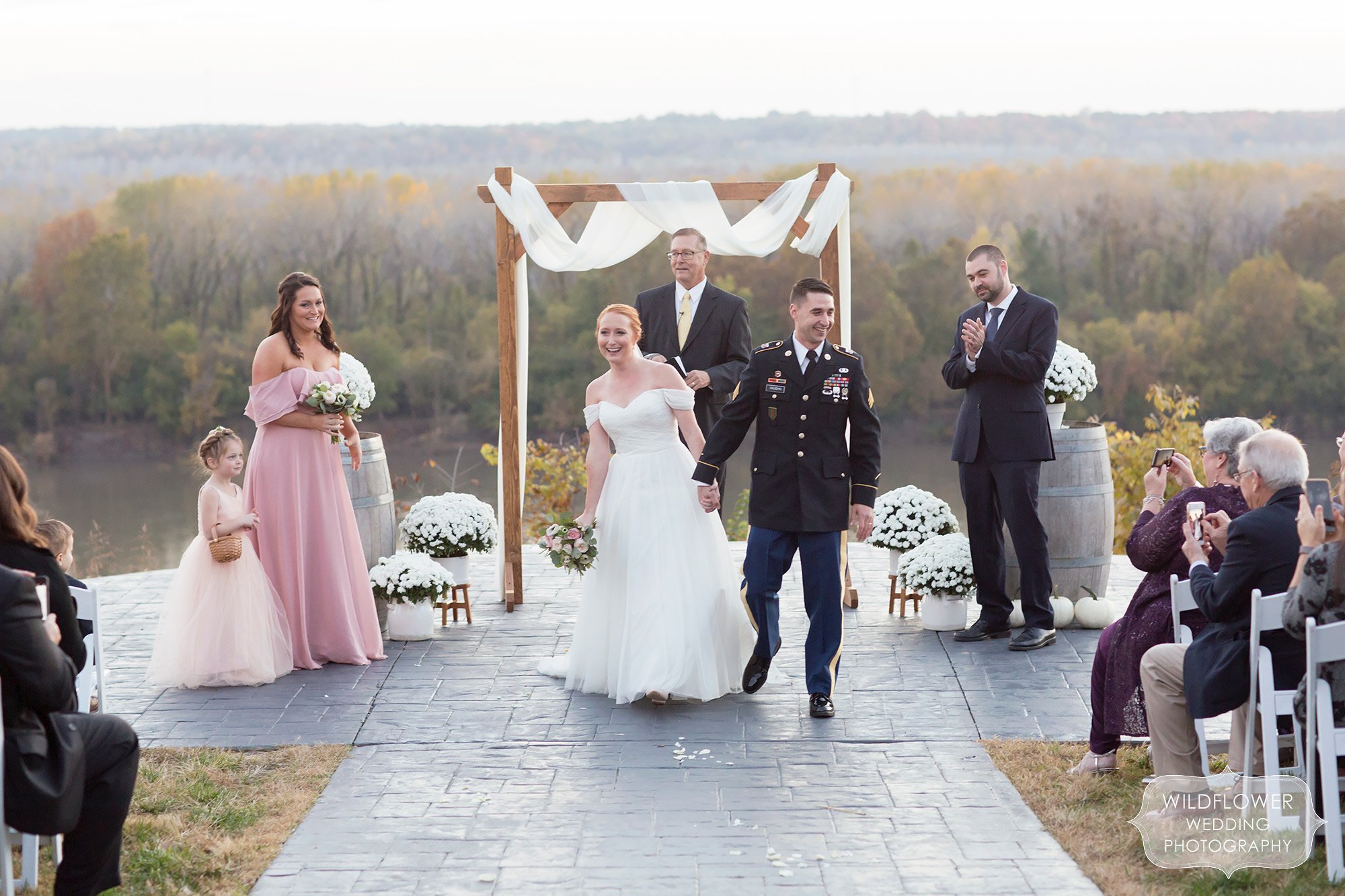 Happy couple leaves ceremony at Les Bourgeois in Rocheport, MO.
