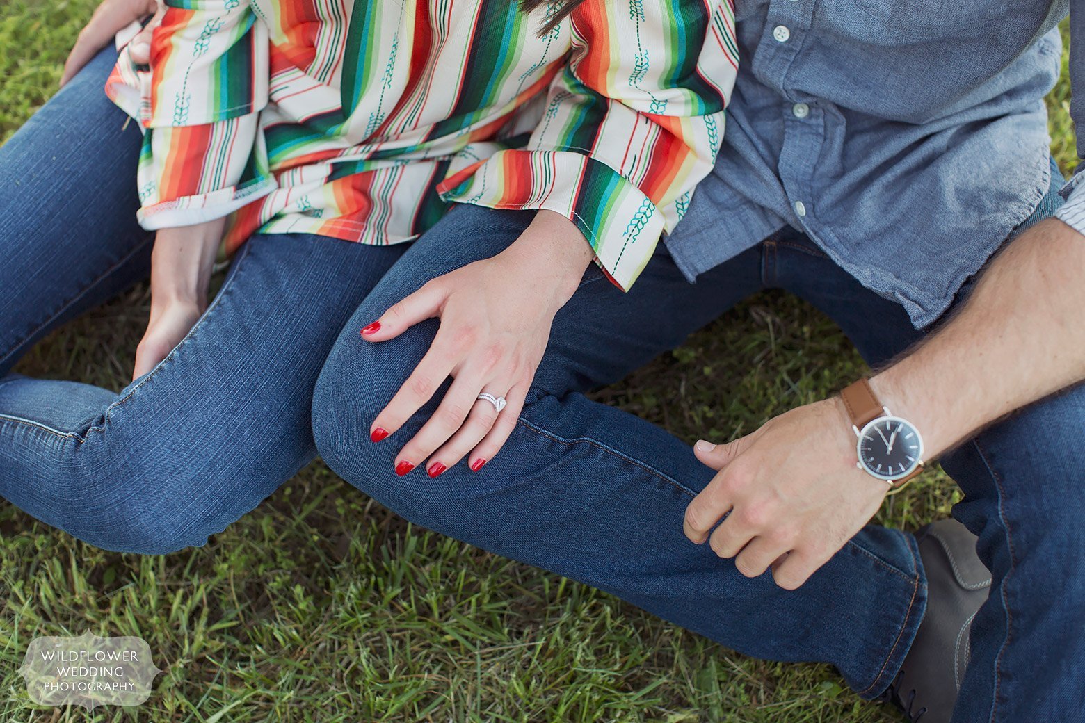 The couple wears a colorful outfit for their engagement session in the country in MO.