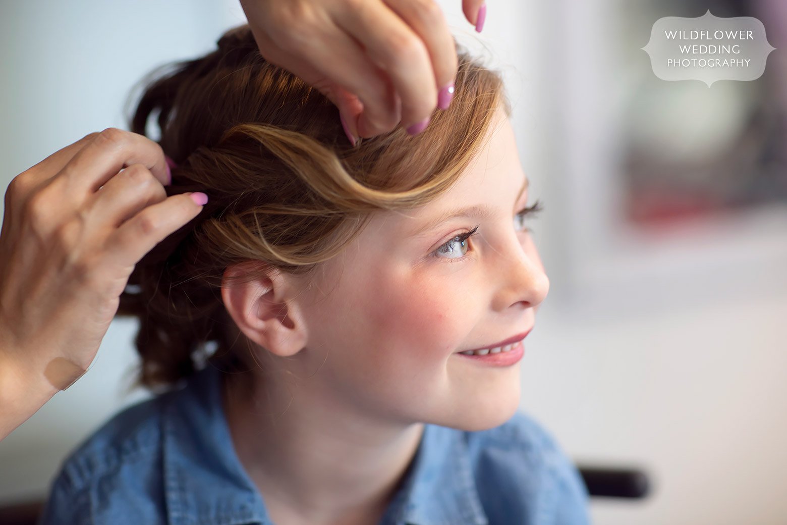 The flower girl has her hair done at Cooper's Ridge bridal suite.