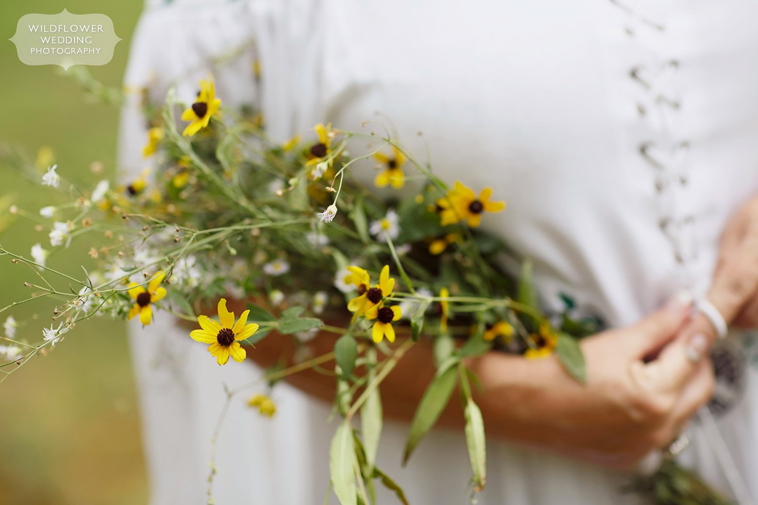 Missouri wildflowers carried by the bride for backyard wedding.