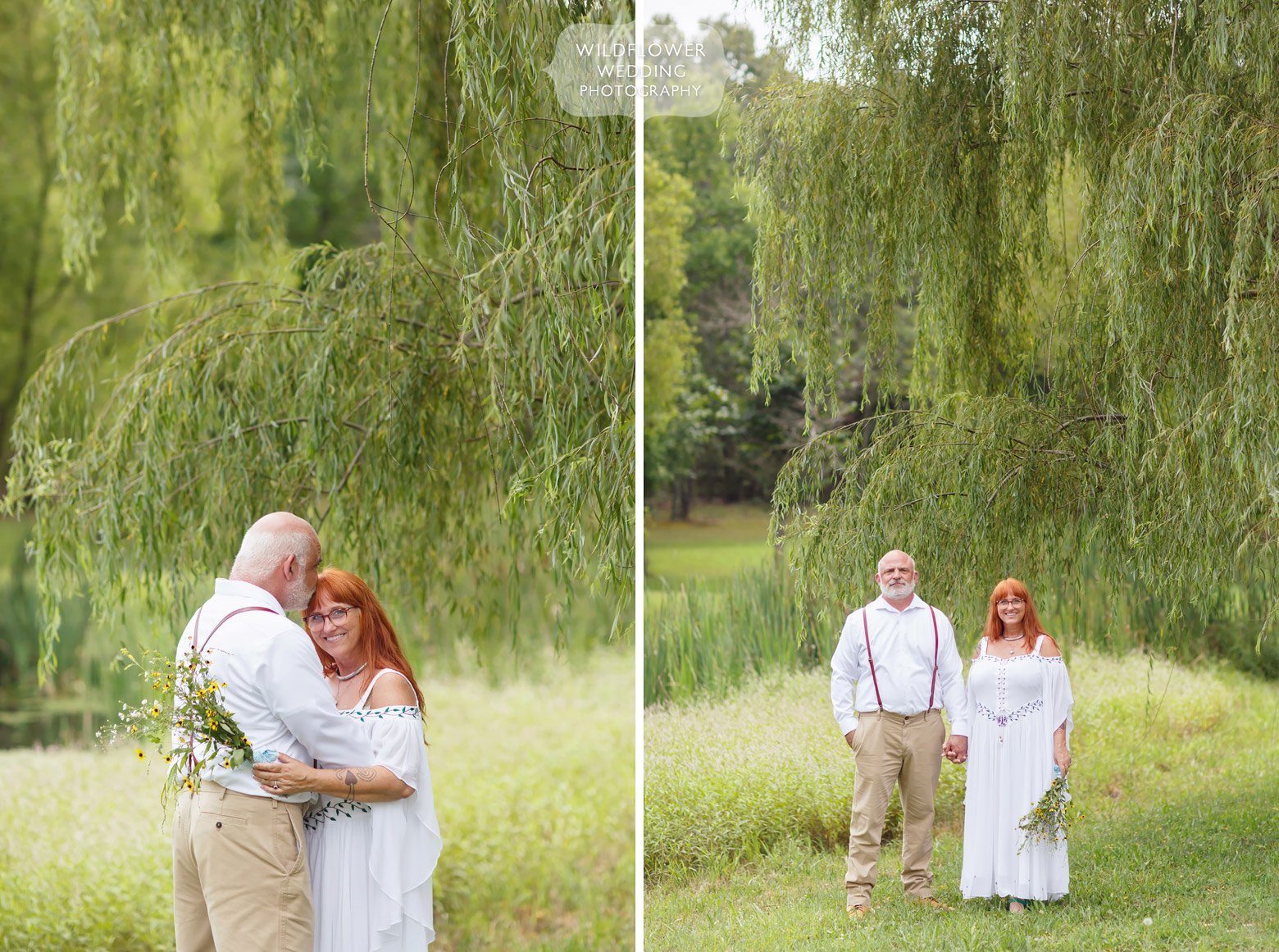 Bride and groom stand under weeping willow tree in Missouri.
